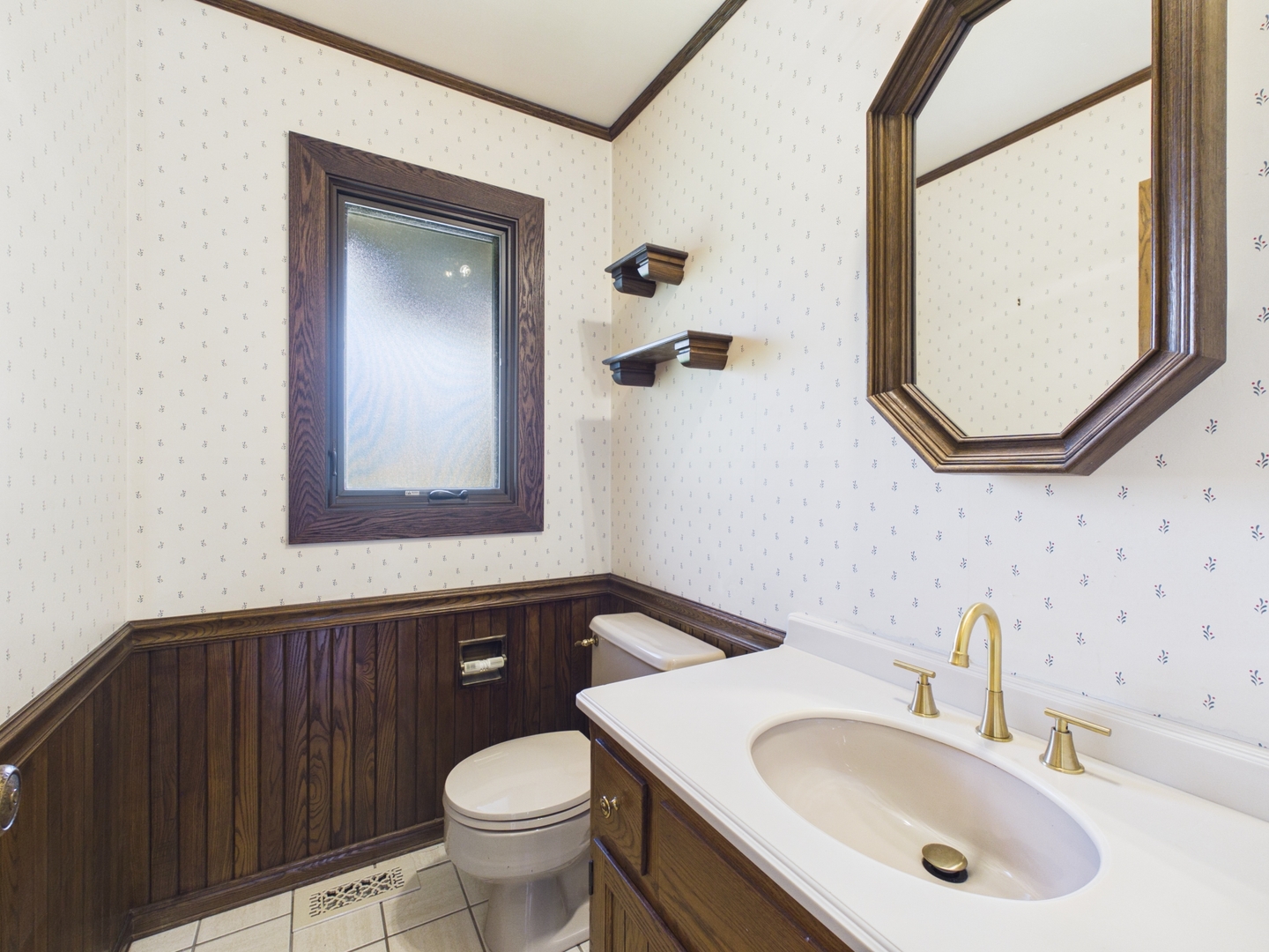 6723 Kingswood Road Willowbrook, IL 60527 - Photo 19 of 51 a bathroom with a sink and a mirror