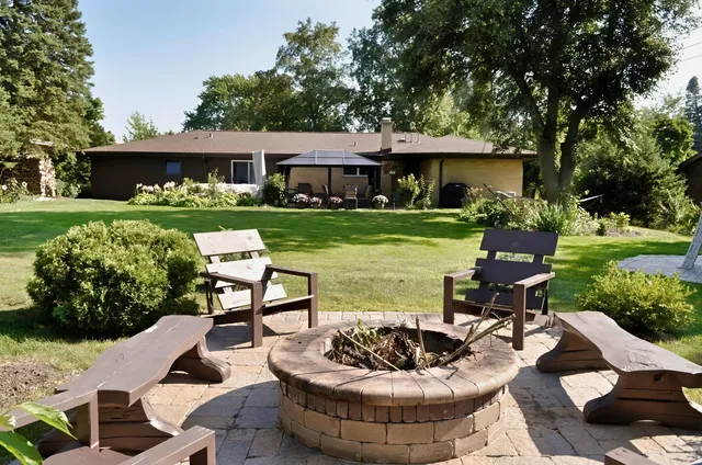 a view of a backyard with large trees