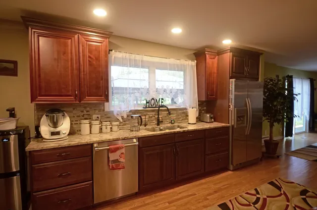 a kitchen with sink and cabinets