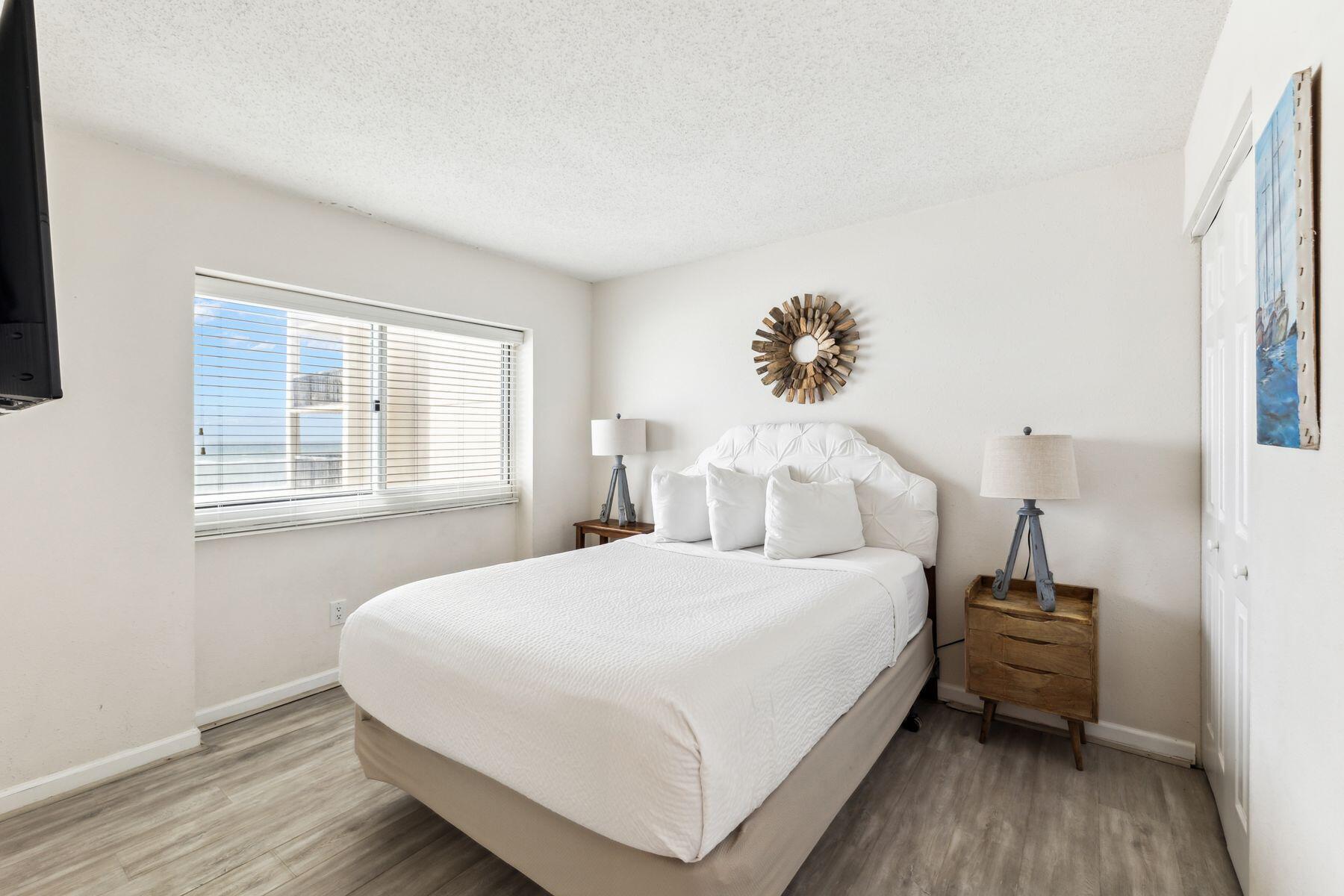 23223 Front Beach Road, Unit B2405 Panama City Beach, FL 32413 - Photo 19 of 28 a bedroom with a bed and a window