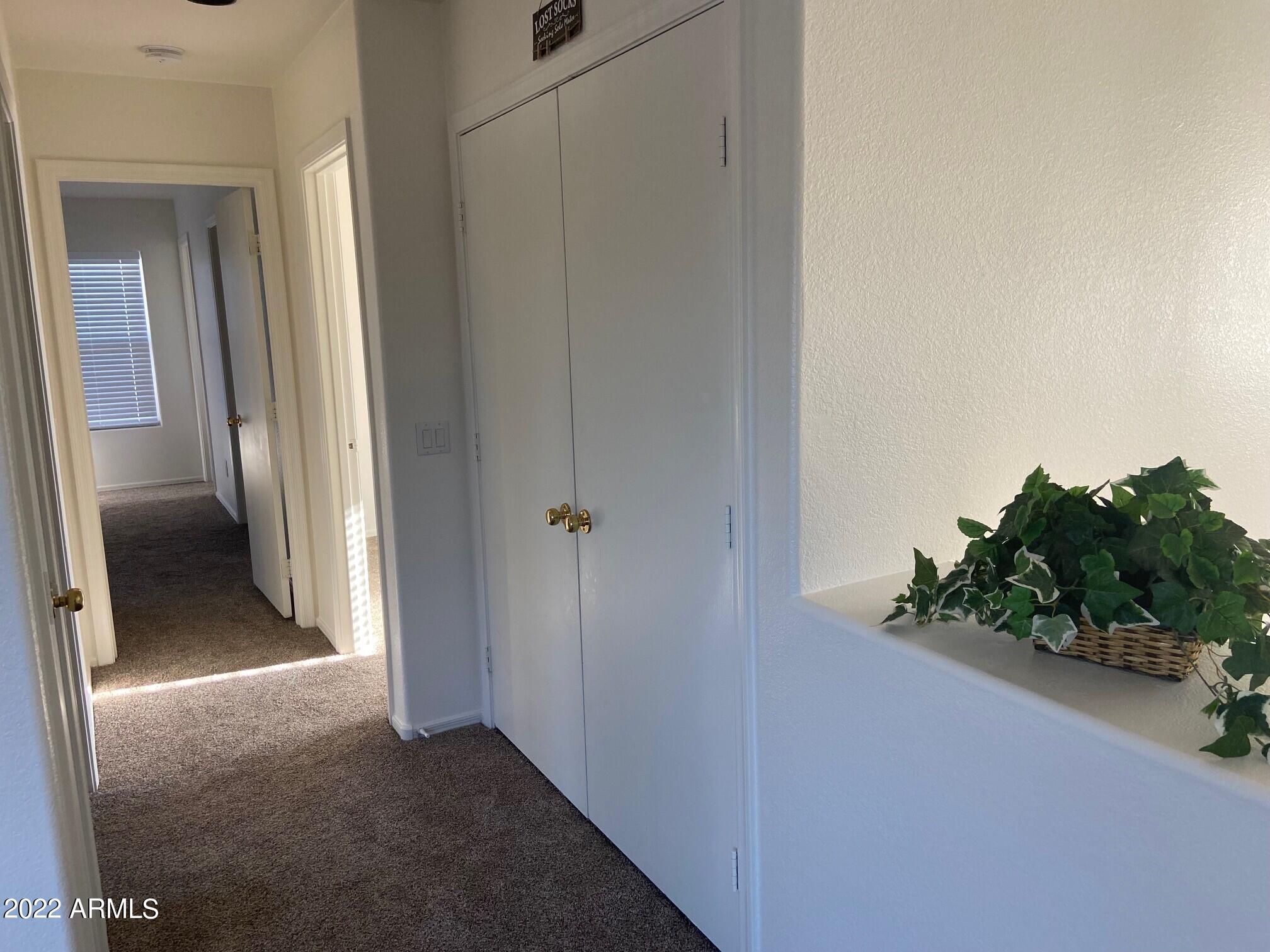 6449 West Constance Way Laveen, AZ 85339 - Photo 15 of 33 upstair hall-laundry