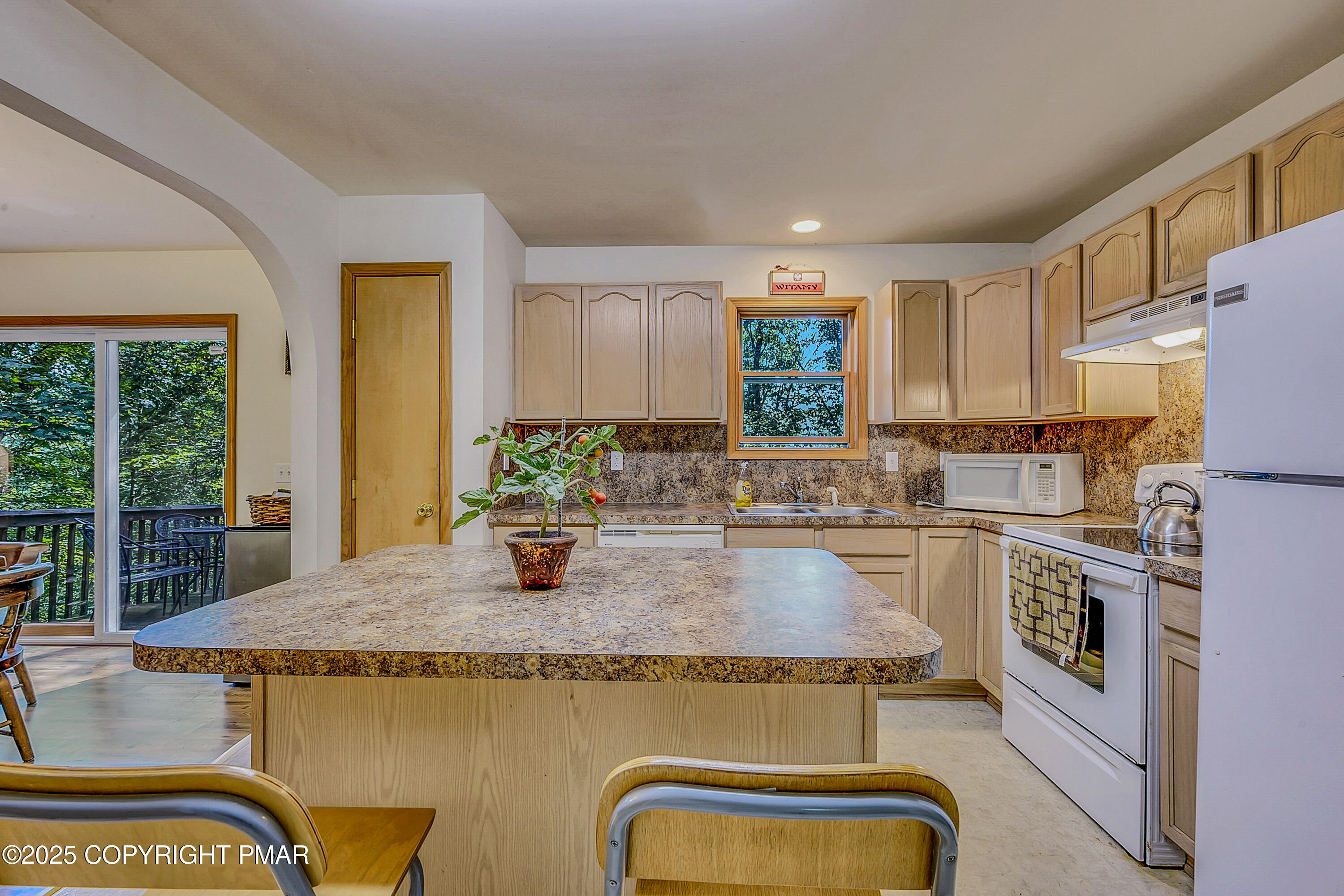164 Bellingham Drive Bushkill, PA 18324 - Photo 11 of 46 a kitchen with stainless steel appliances granite countertop a sink a stove top oven a counter space and cabinets