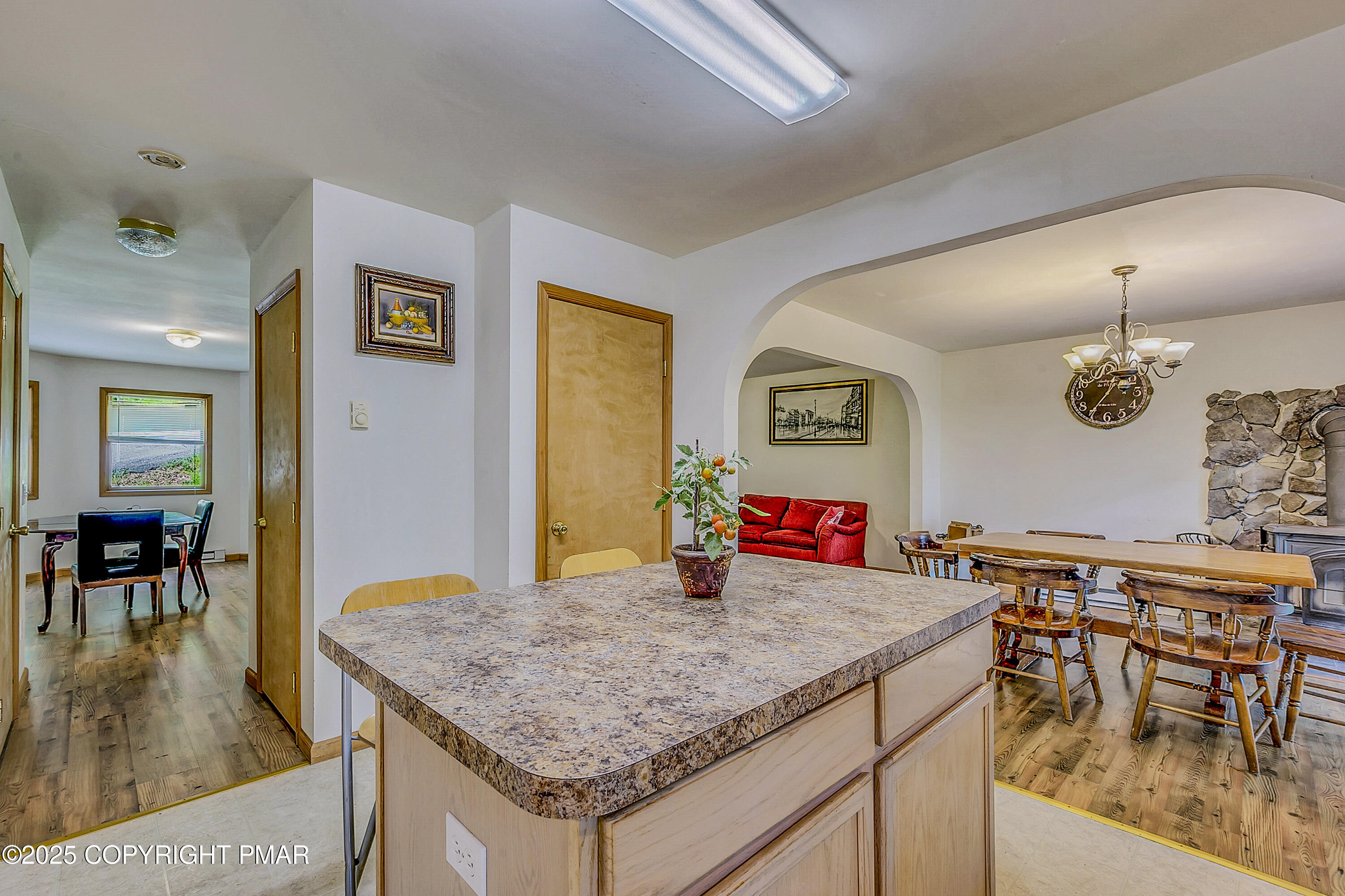 164 Bellingham Drive Bushkill, PA 18324 - Photo 12 of 46 a kitchen with a table and chairs in it