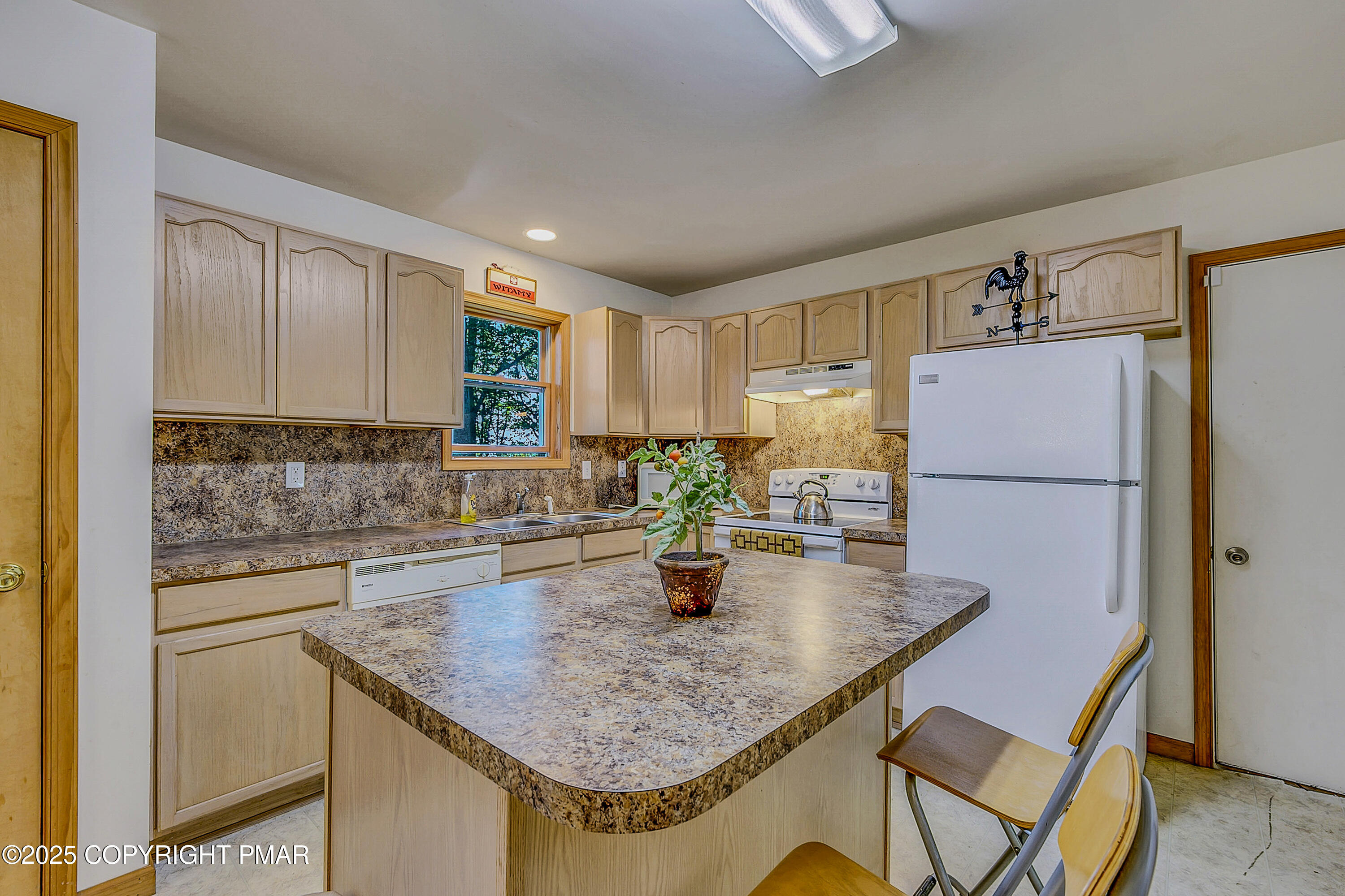 164 Bellingham Drive Bushkill, PA 18324 - Photo 13 of 46 a kitchen with stainless steel appliances granite countertop a sink refrigerator and microwave