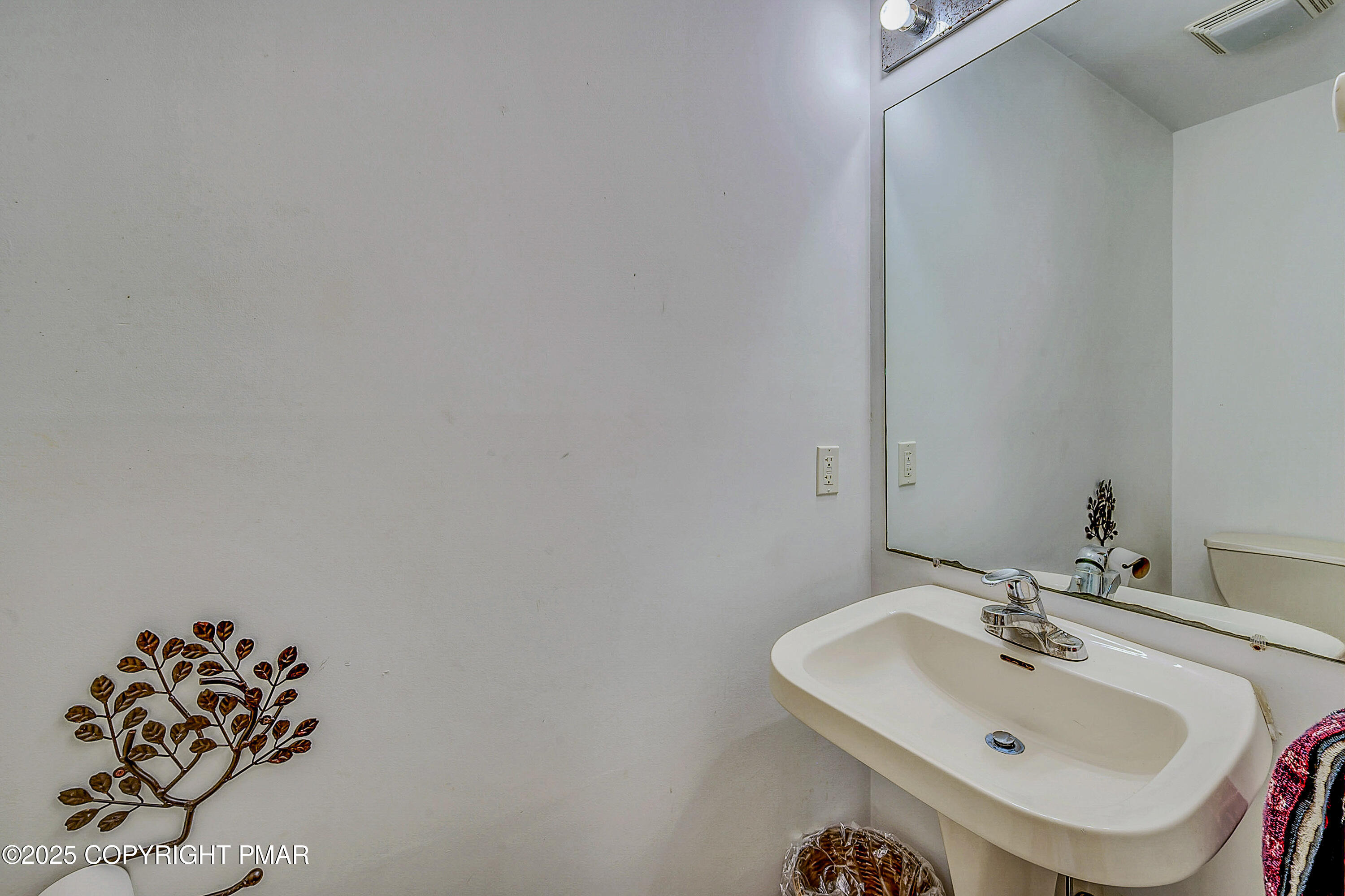 164 Bellingham Drive Bushkill, PA 18324 - Photo 16 of 46 a bathroom with a sink and a mirror