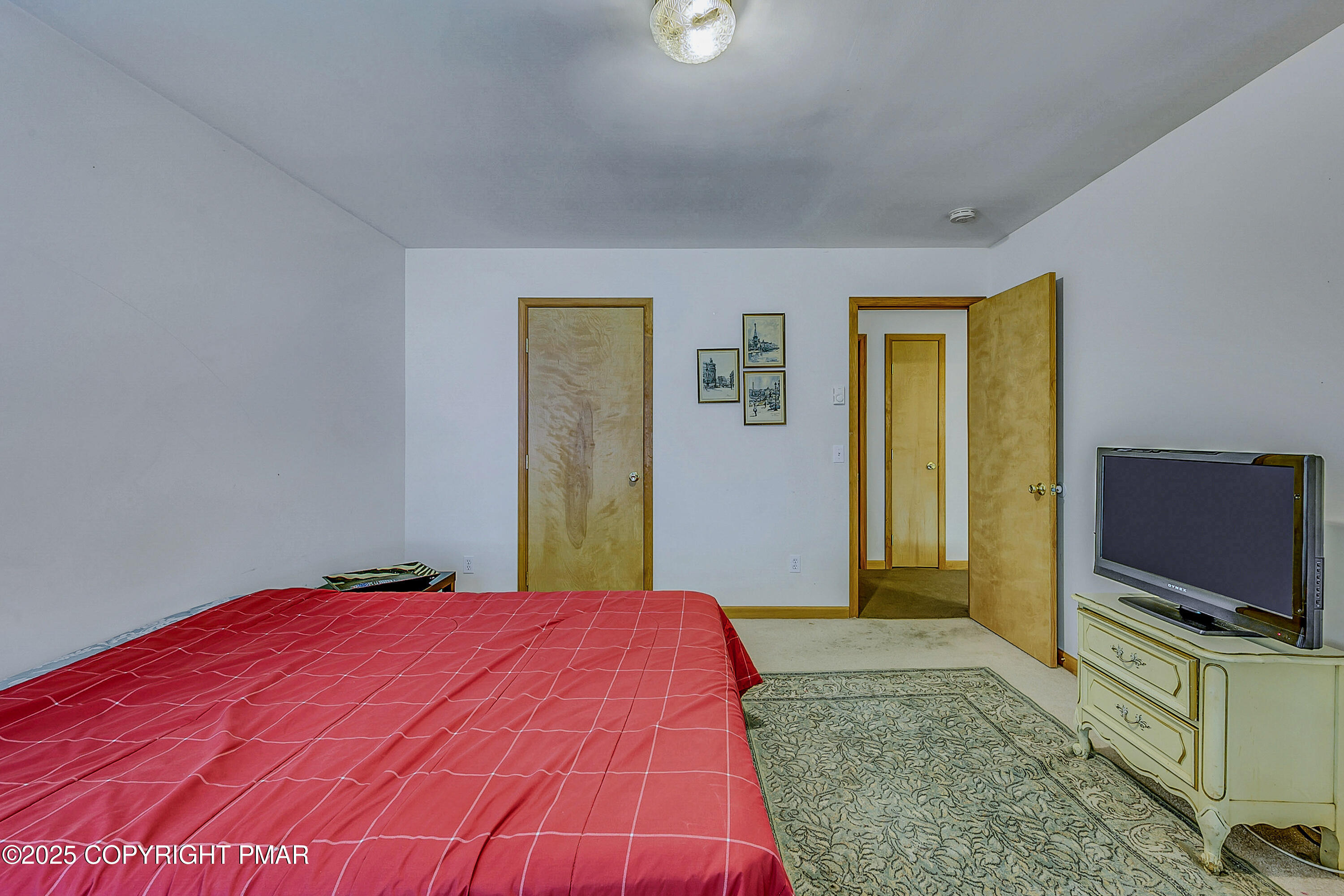 164 Bellingham Drive Bushkill, PA 18324 - Photo 26 of 46 a bedroom with a bed and a flat screen tv