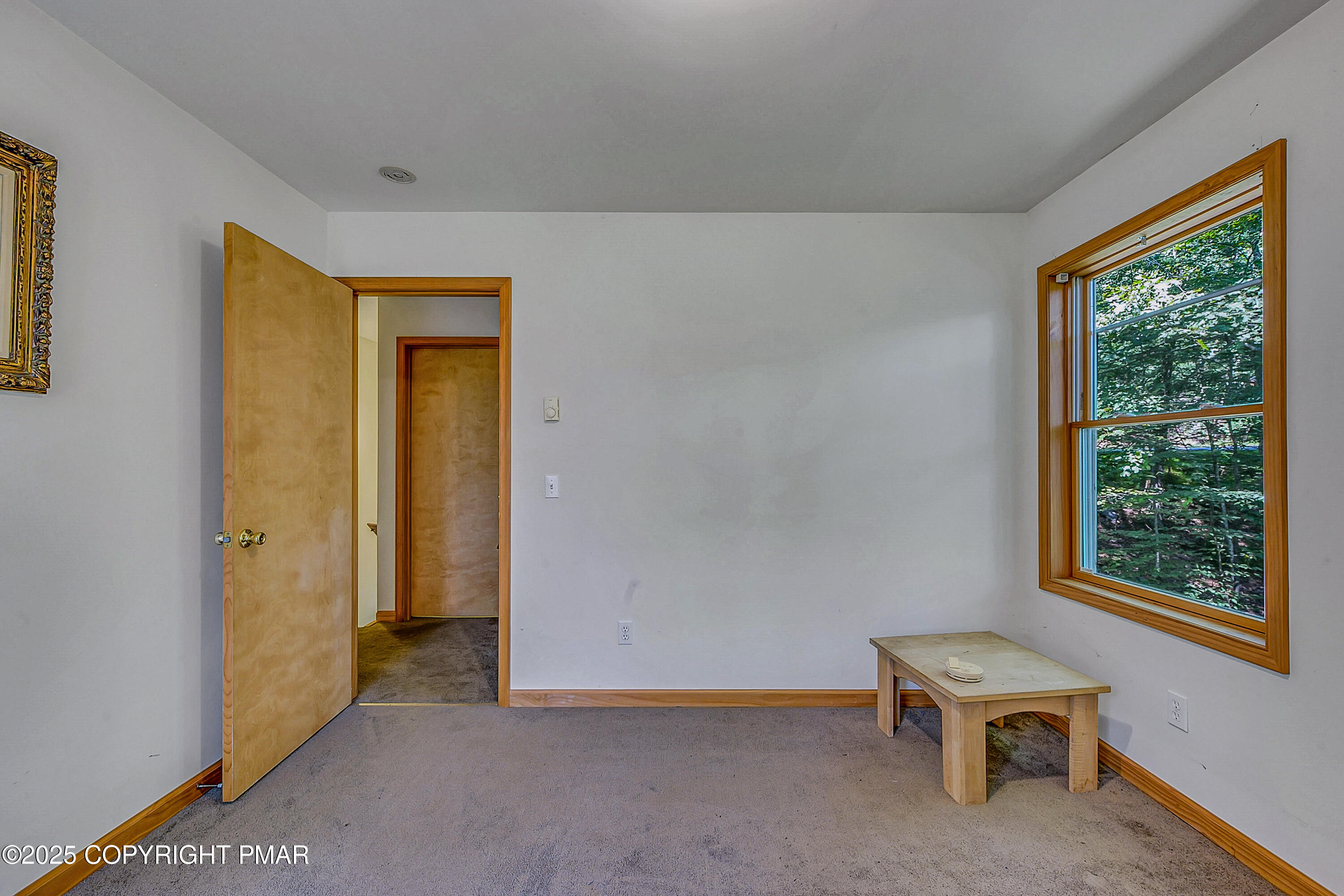 164 Bellingham Drive Bushkill, PA 18324 - Photo 28 of 46 a room with a window and a chair