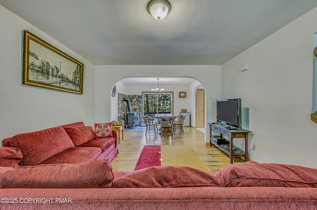 a living room with furniture and a flat screen tv