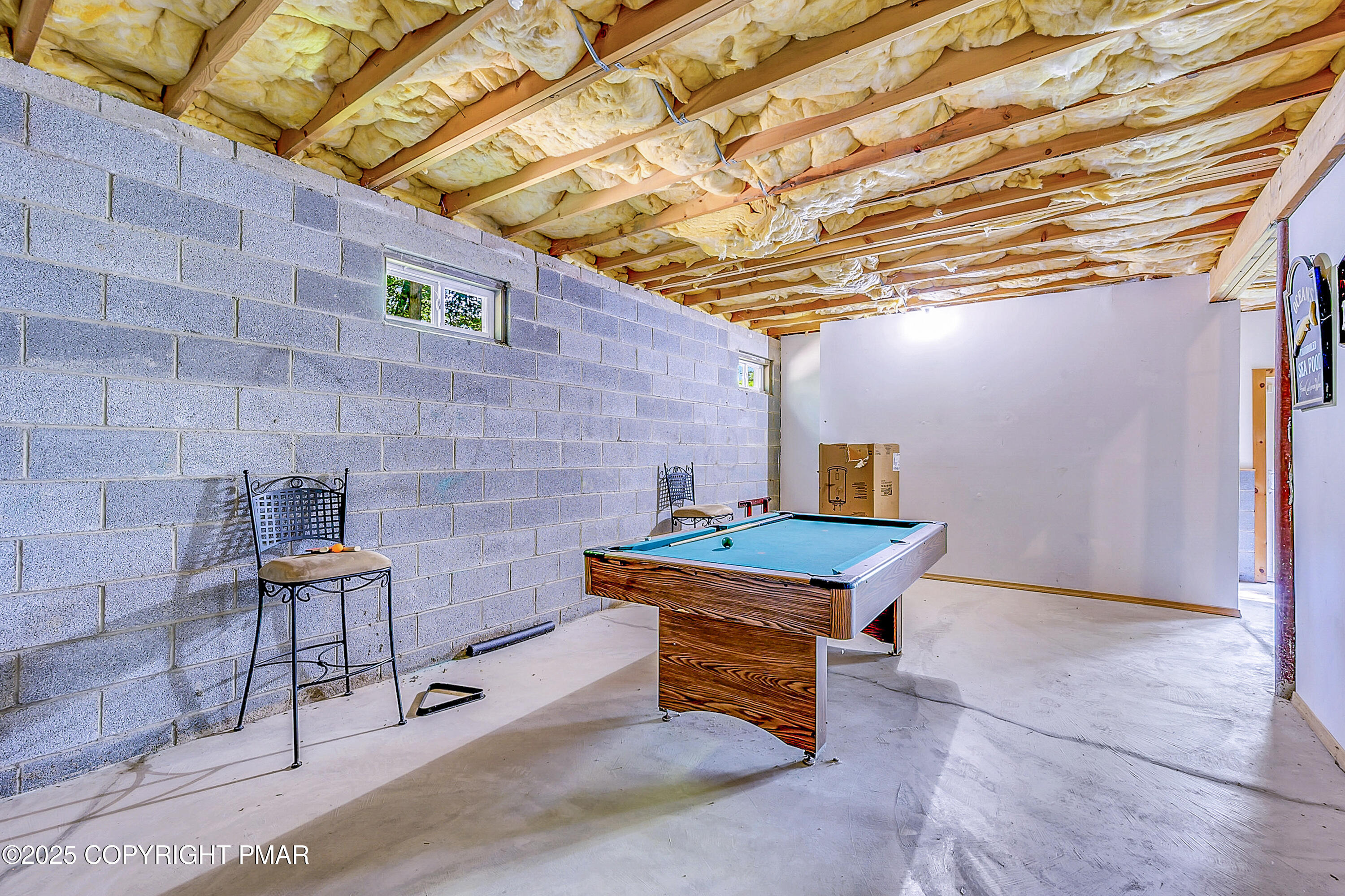 164 Bellingham Drive Bushkill, PA 18324 - Photo 41 of 46 a backyard of a house with chairs and a table