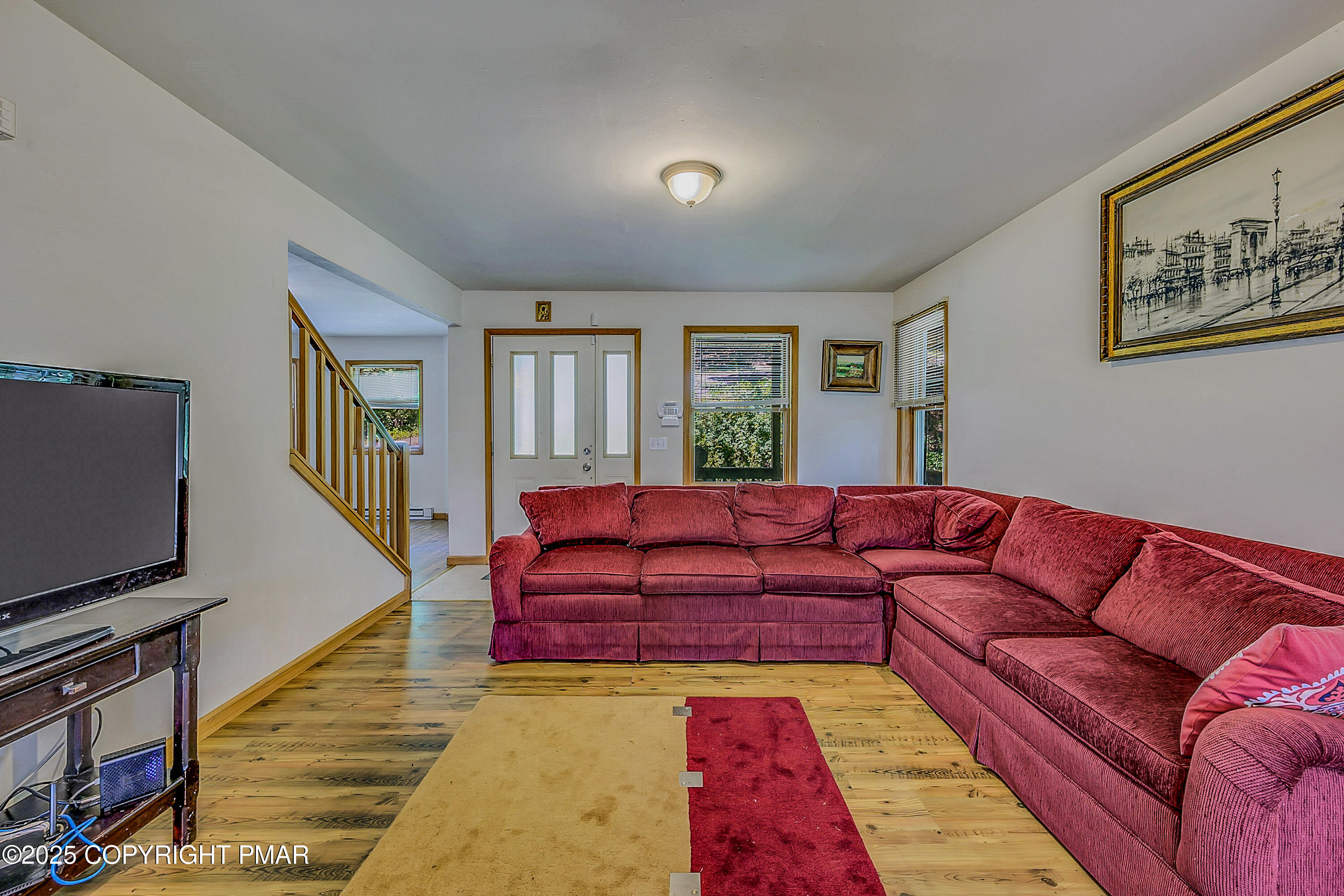 164 Bellingham Drive Bushkill, PA 18324 - Photo 6 of 46 a living room with furniture and a flat screen tv