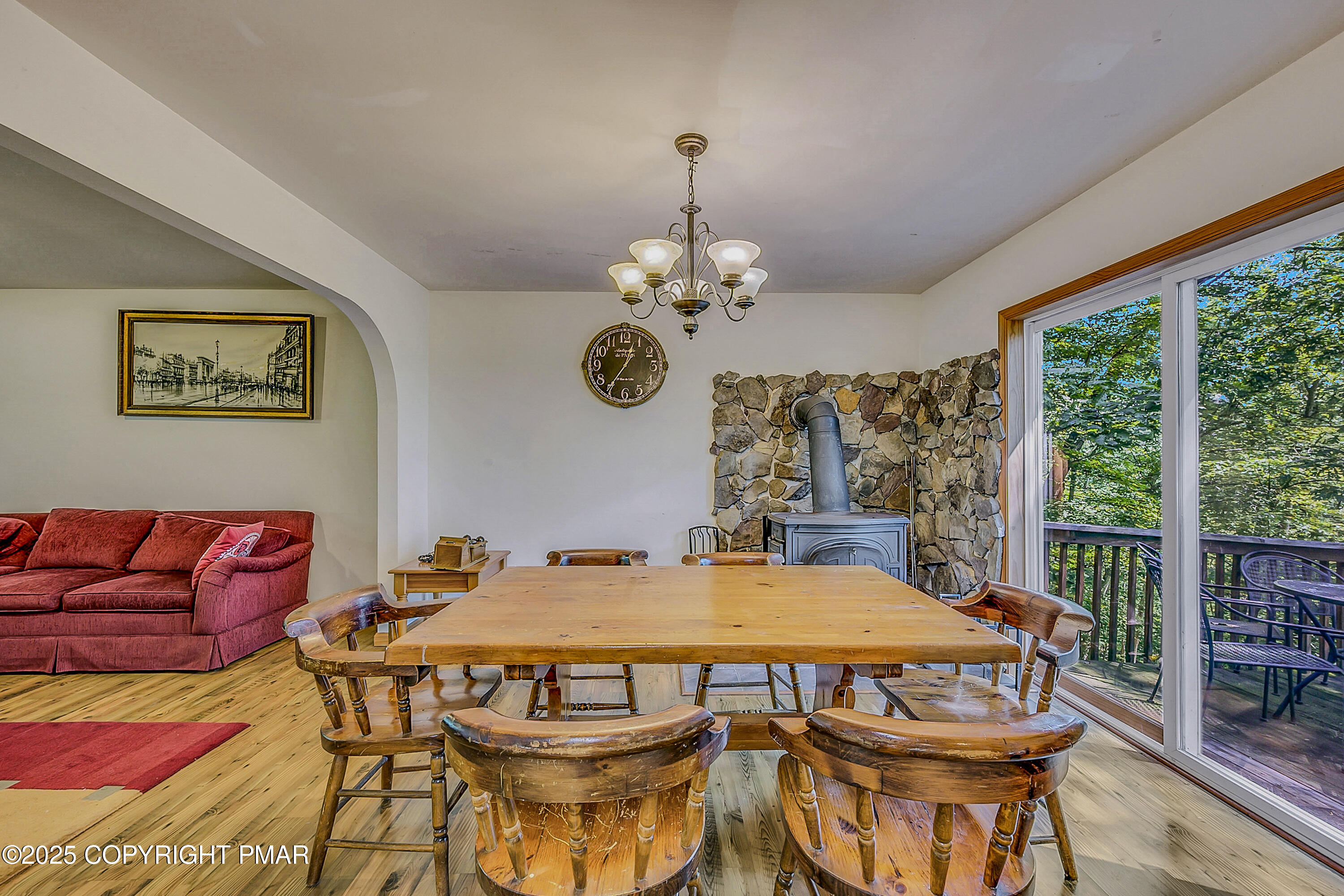 164 Bellingham Drive Bushkill, PA 18324 - Photo 8 of 46 a view of a dining room with furniture wooden floor and chandelier