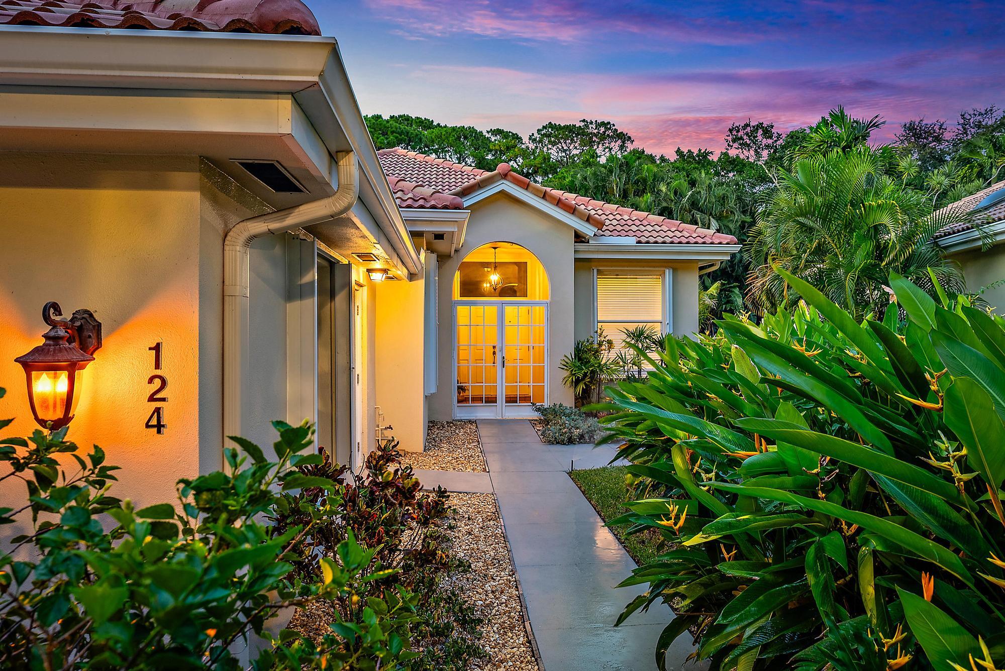 a view of a house with a flower garden