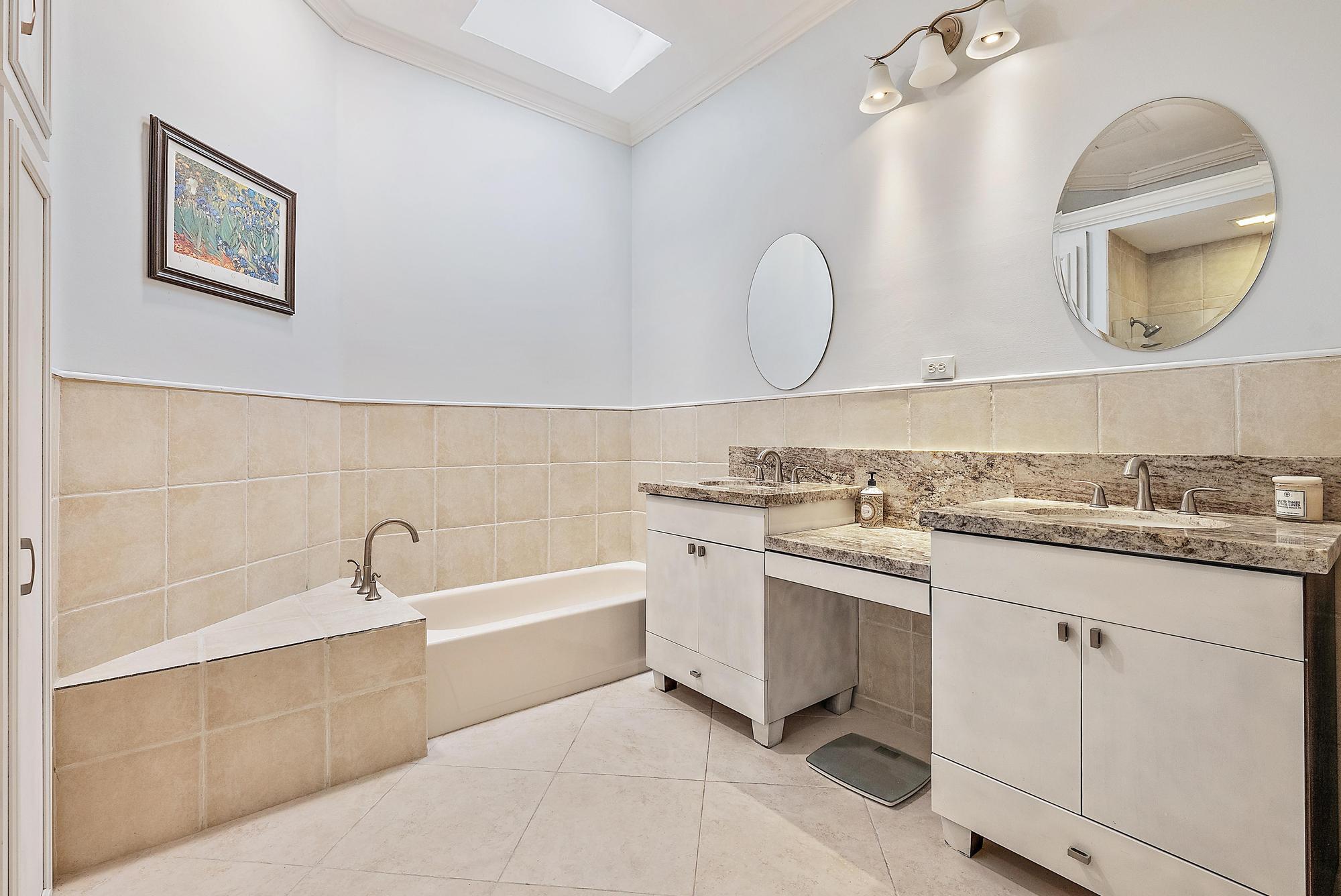 124 South Hampton Drive Jupiter, FL 33458 - Photo 16 of 39 a bathroom with a sink and a mirror