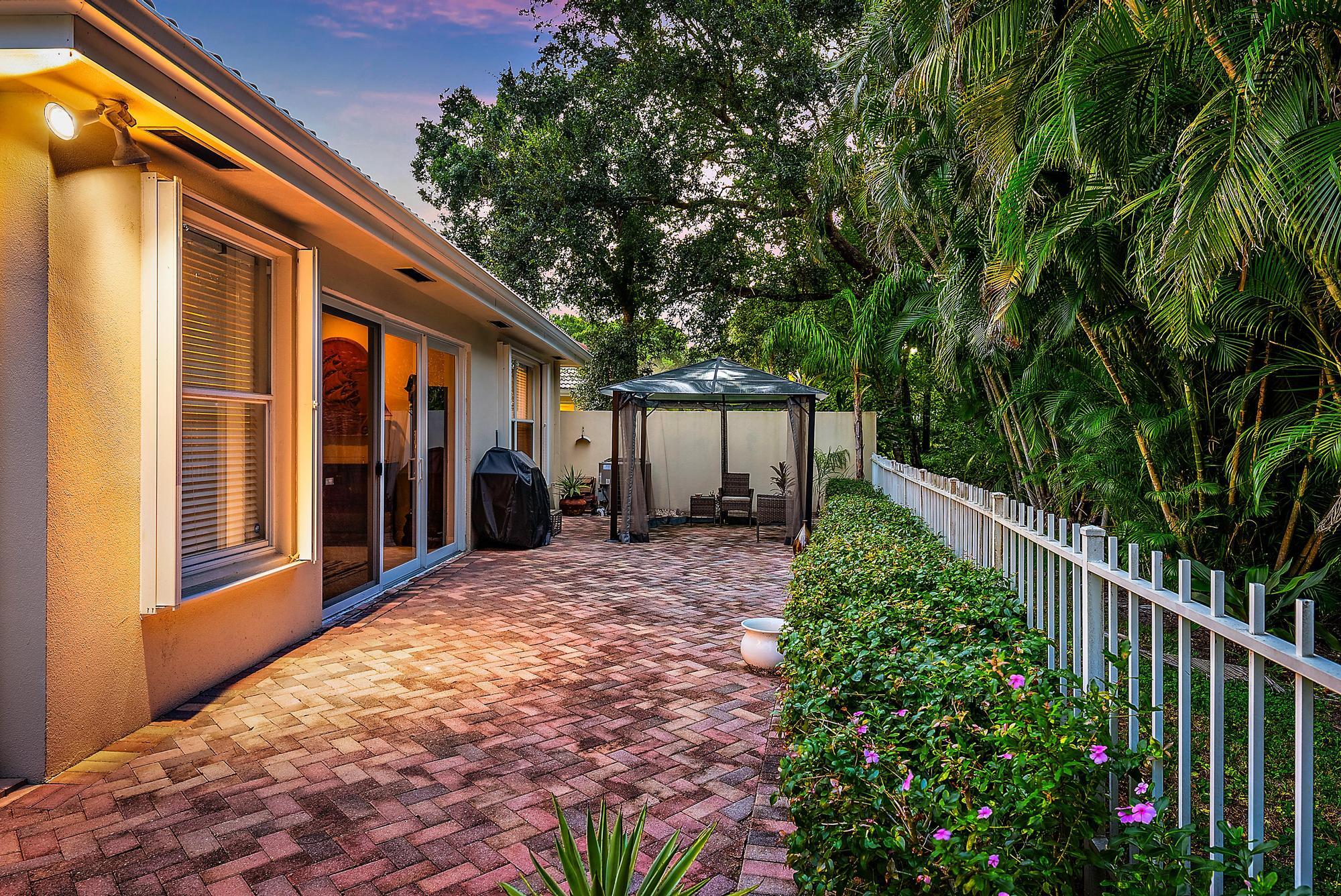 124 South Hampton Drive Jupiter, FL 33458 - Photo 24 of 39 a view of a house with backyard and a tree