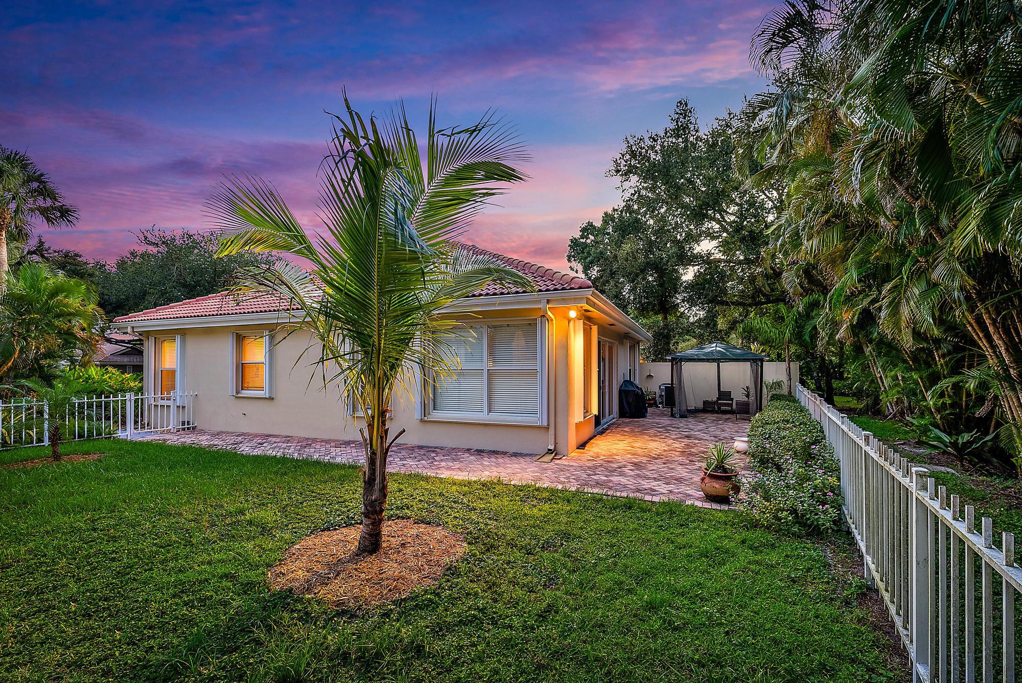 124 South Hampton Drive Jupiter, FL 33458 - Photo 26 of 39 a front view of a house with garden