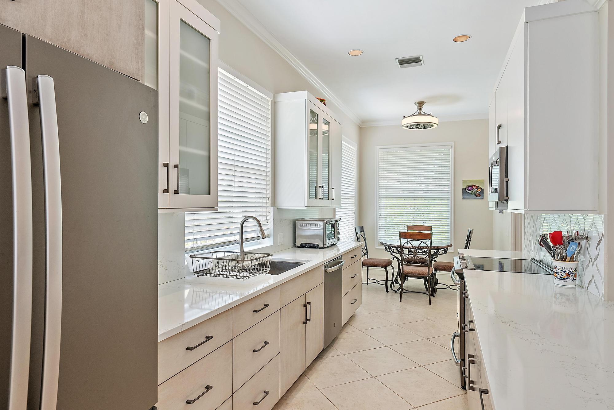 124 South Hampton Drive Jupiter, FL 33458 - Photo 6 of 39 a spacious bathroom with a double vanity sink mirror and a bathtub