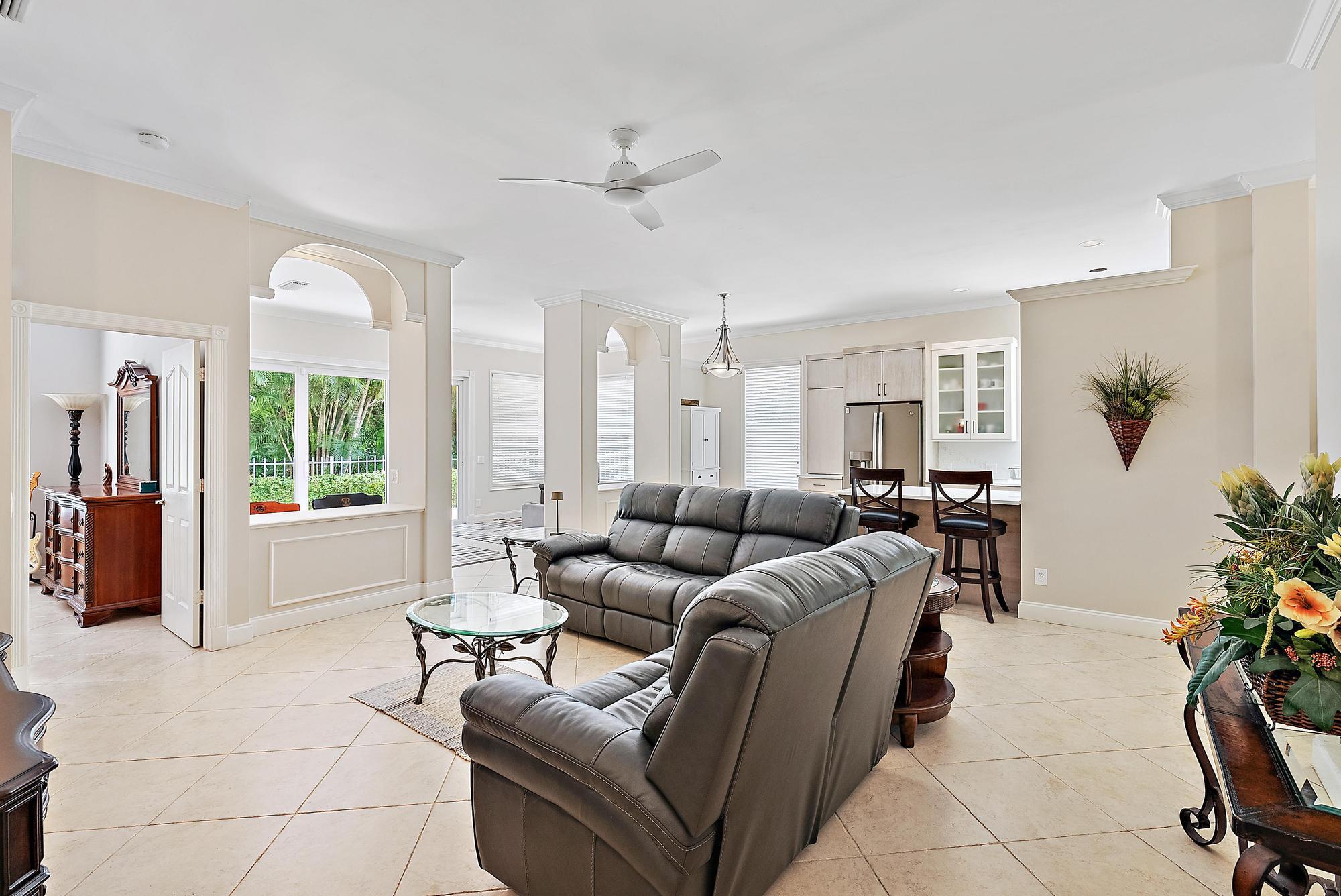 124 South Hampton Drive Jupiter, FL 33458 - Photo 10 of 39 a living room with furniture and a large window