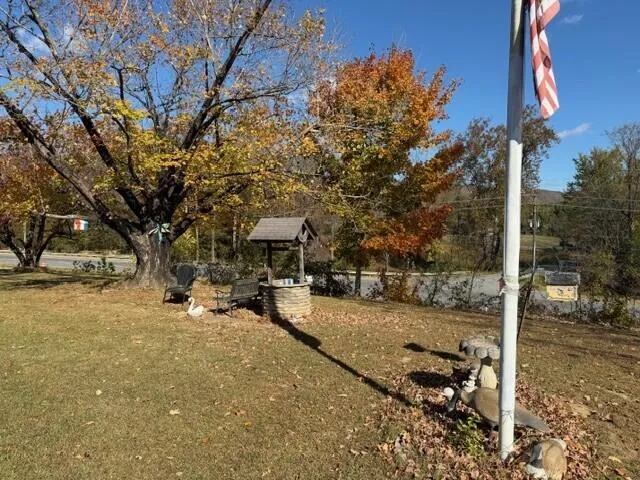 a view of a patio with table and chairs and potted plants