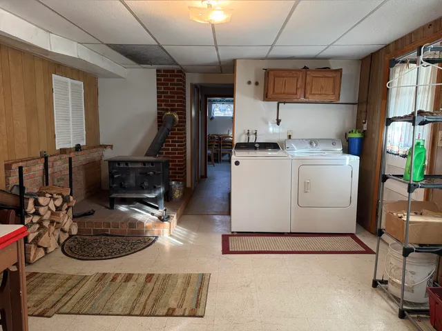 a kitchen with a sink appliances and cabinets