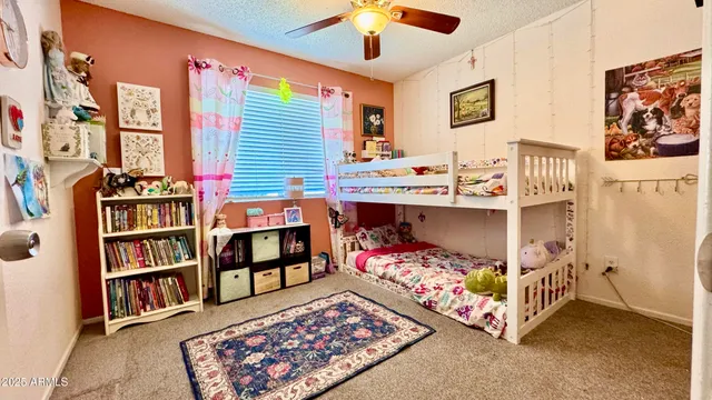 a bed room with a bed and a book shelf