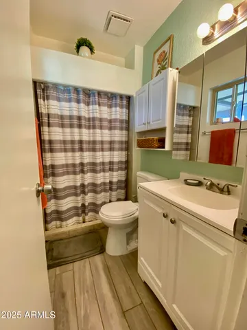 a view of a park with chairs and tables