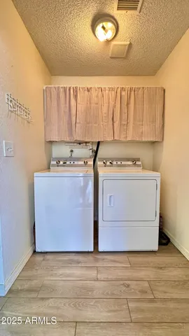 a view of a kitchen with a stove top oven