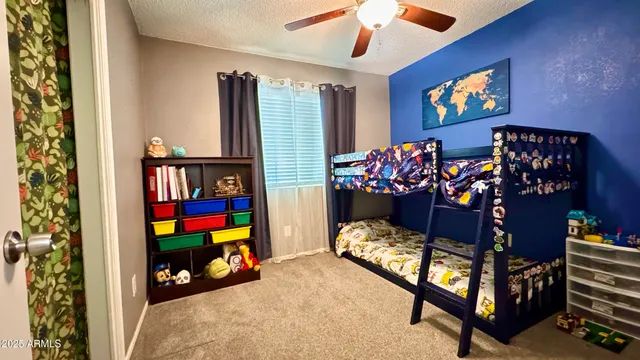 a view of game room with entryway and toys