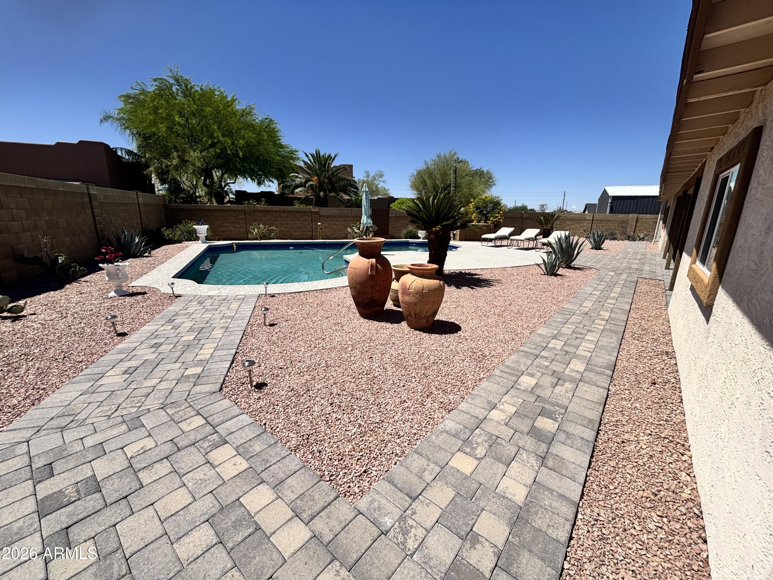 7745 East Mangun Road Mesa, AZ 85207 - Photo 7 of 35 a view of swimming pool with sitting area