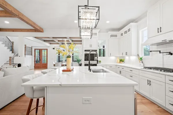 a kitchen with stainless steel appliances kitchen island a large island in the center