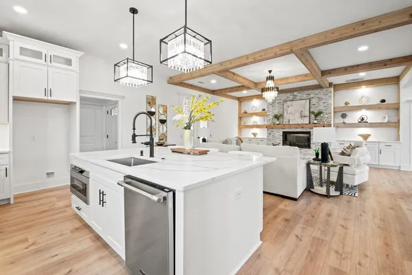 a bathroom with a toilet a sink and a window