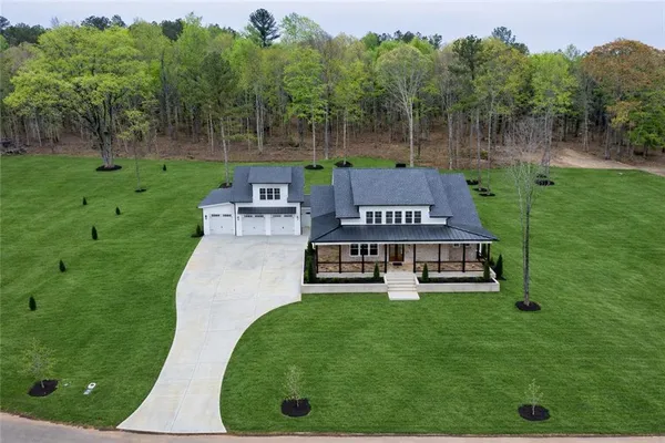 an aerial view of a house with a garden