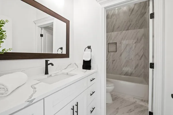 a view of a large house with a big yard and large trees