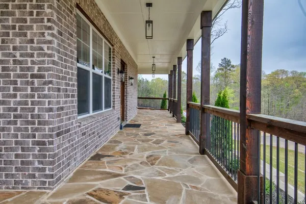 a view of a brick house with a large windows
