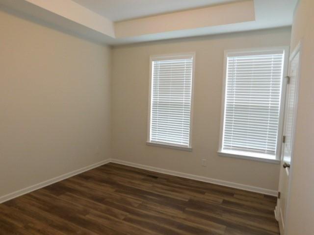 139 Pacer Place Atlanta, GA 30342 - Photo 25 of 31 a view of an empty room with wooden floor and a window