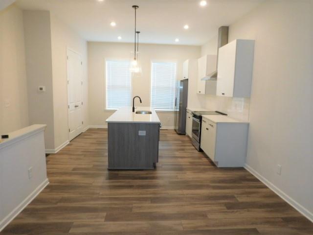 139 Pacer Place Atlanta, GA 30342 - Photo 9 of 31 a large kitchen with stainless steel appliances granite countertop a large center island a sink dishwasher and a refrigerator