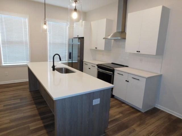 139 Pacer Place Atlanta, GA 30342 - Photo 10 of 31 a kitchen with stainless steel appliances granite countertop a sink a stove and a refrigerator