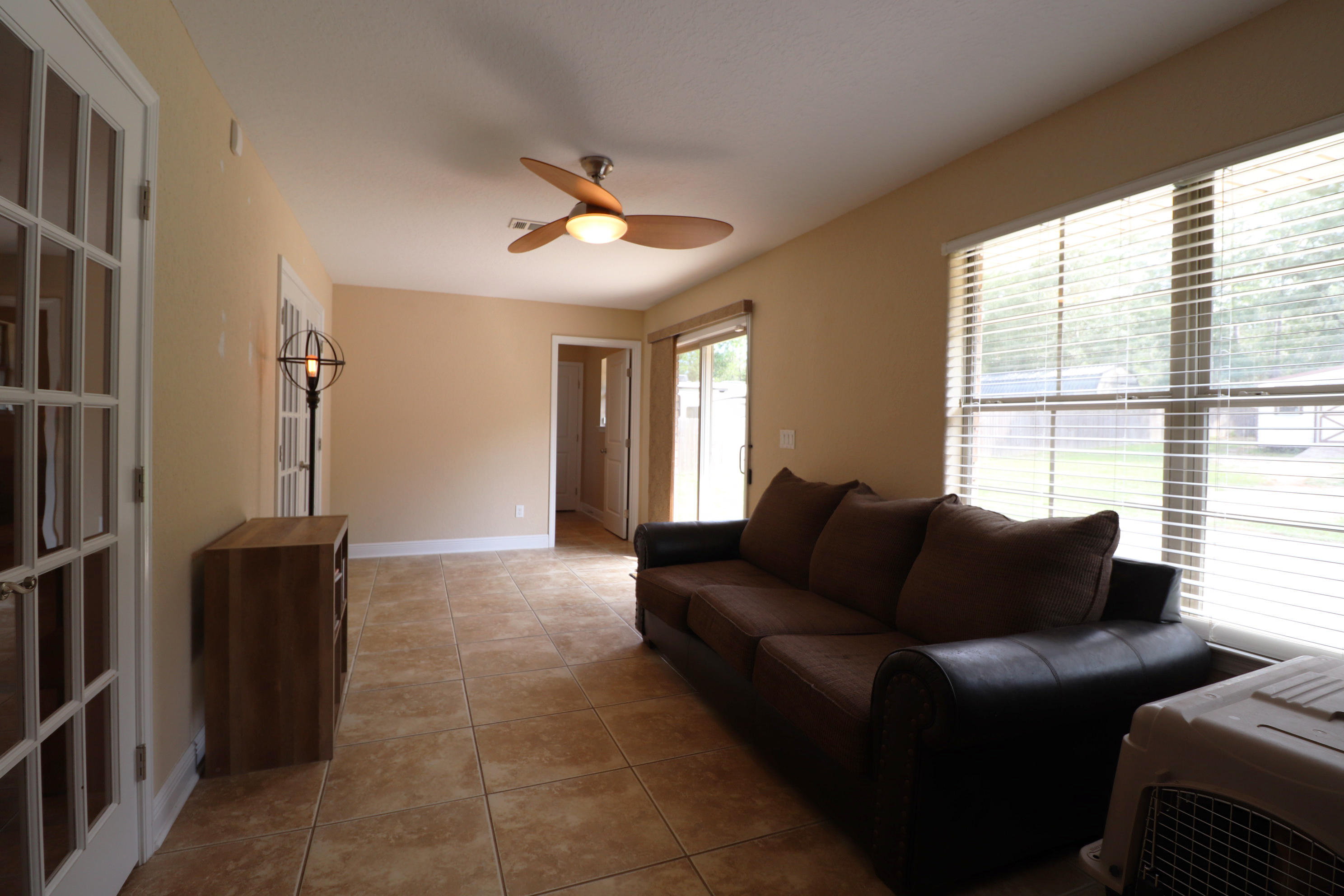6181 Hummingbird Lane Crestview, FL 32536 - Photo 16 of 56 a living room with furniture and a window