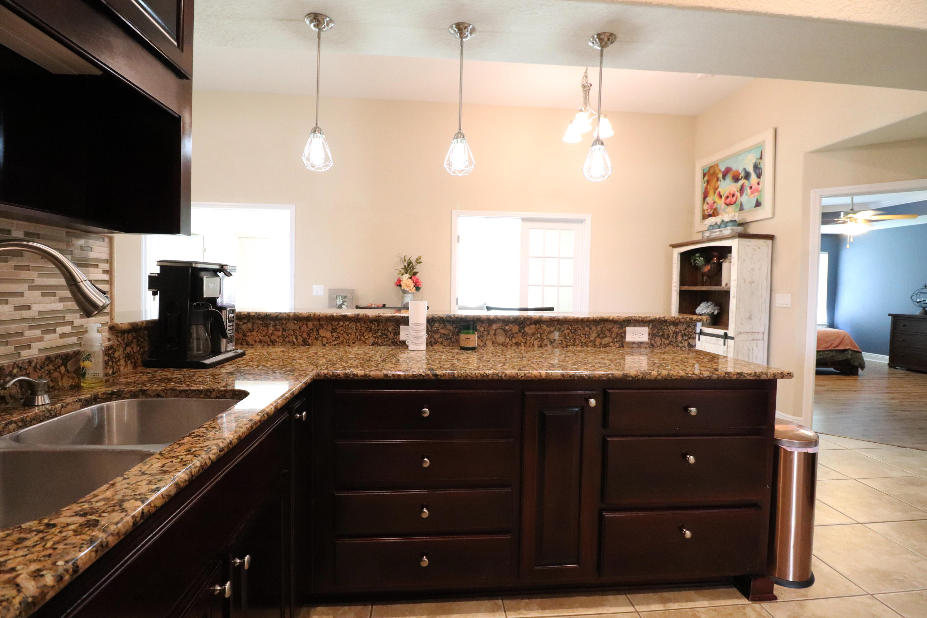 6181 Hummingbird Lane Crestview, FL 32536 - Photo 22 of 56 a kitchen with a sink and a stove