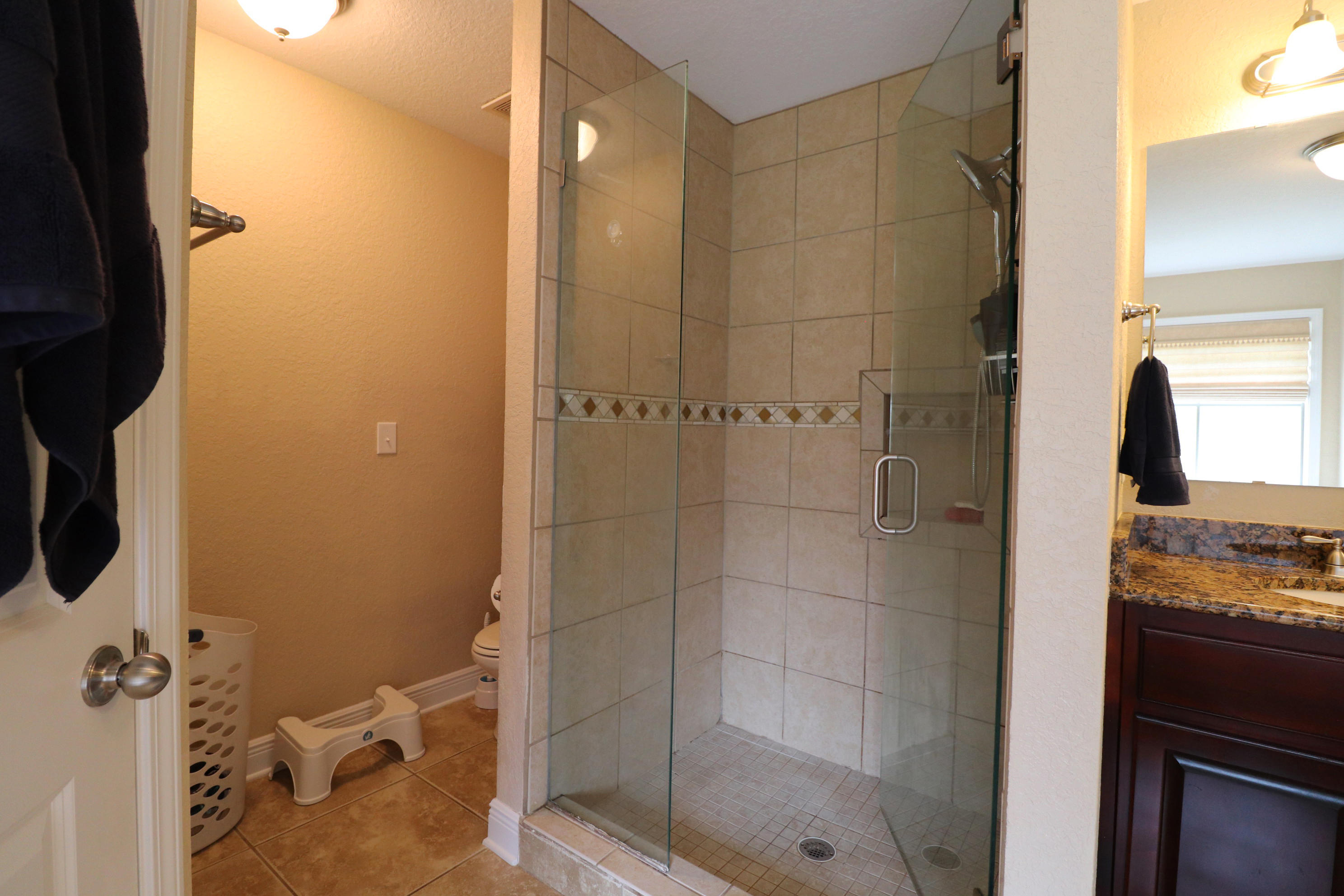 6181 Hummingbird Lane Crestview, FL 32536 - Photo 28 of 56 a bathroom with a shower and a sink