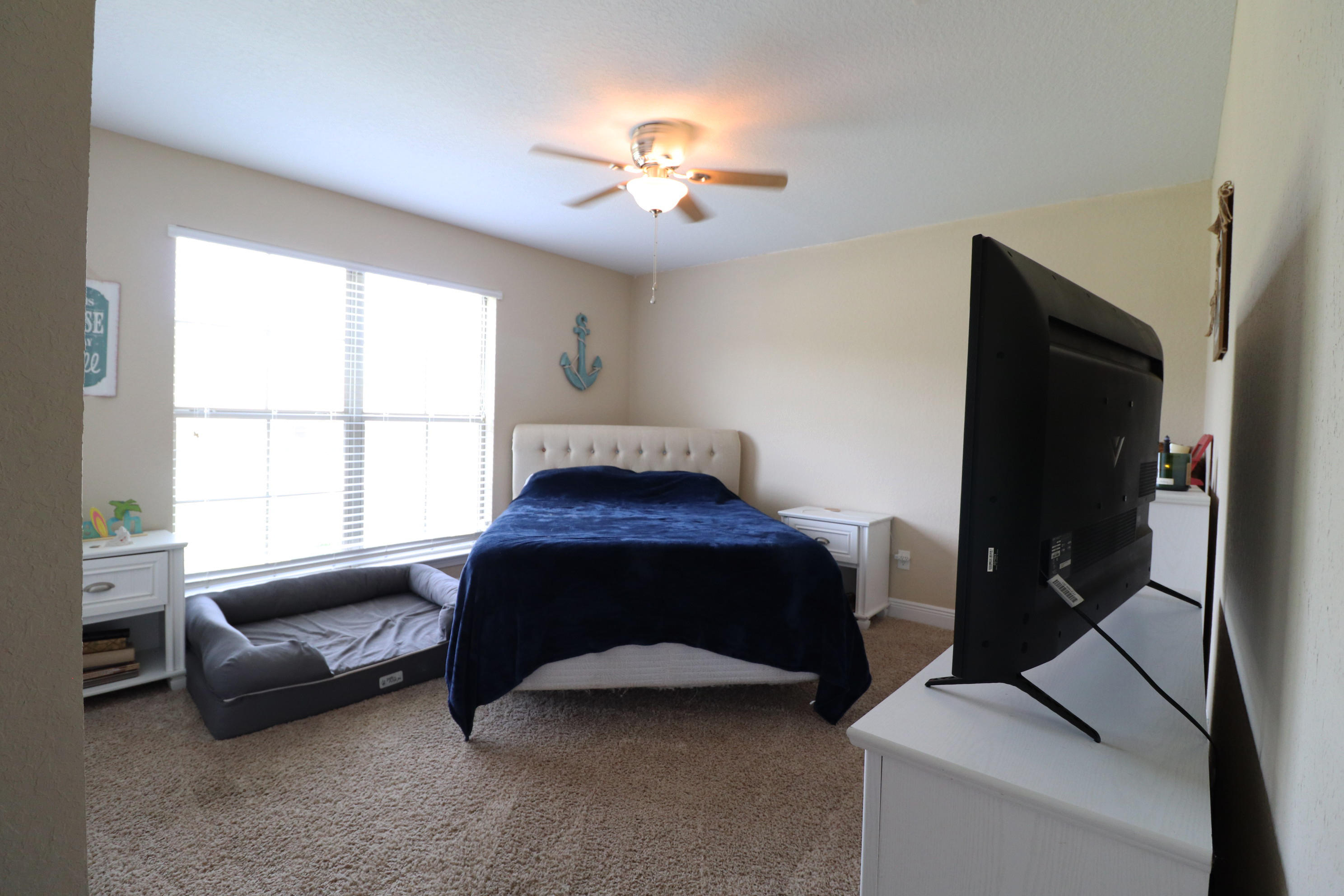 6181 Hummingbird Lane Crestview, FL 32536 - Photo 30 of 56 a living room with furniture and a flat screen tv