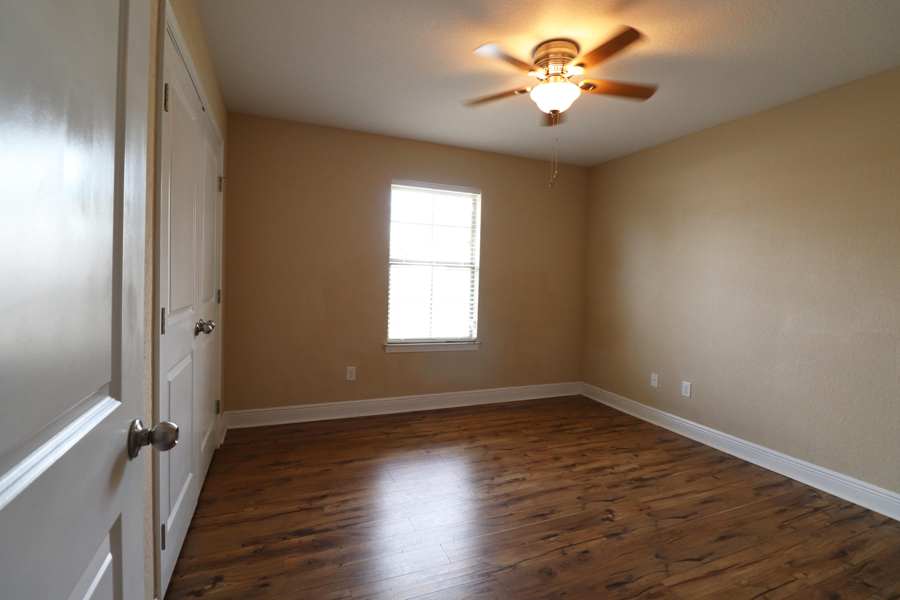 6181 Hummingbird Lane Crestview, FL 32536 - Photo 33 of 56 a view of a room with a window and wooden floor