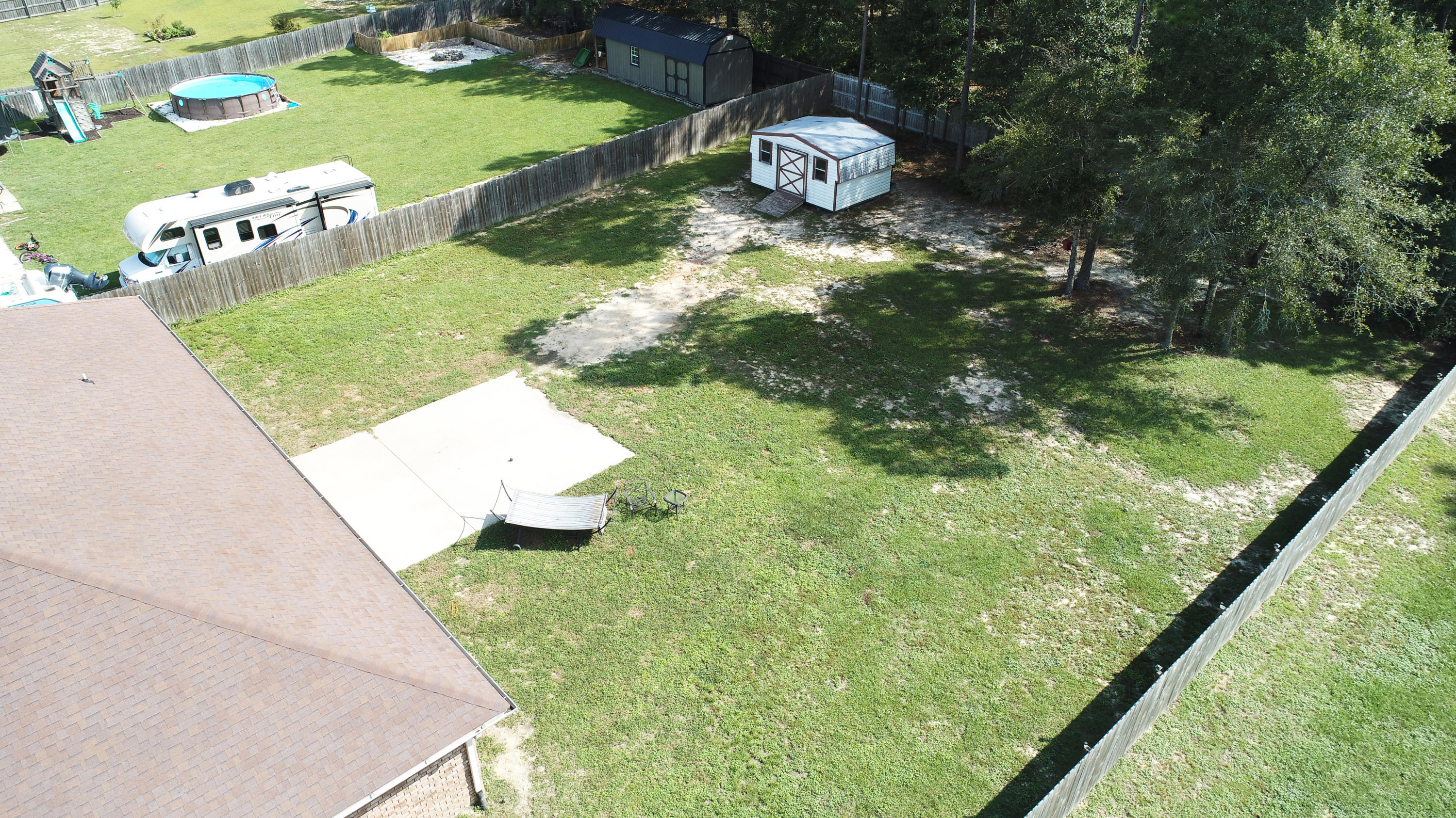 6181 Hummingbird Lane Crestview, FL 32536 - Photo 46 of 56 a view of a wooden floor and fire pit