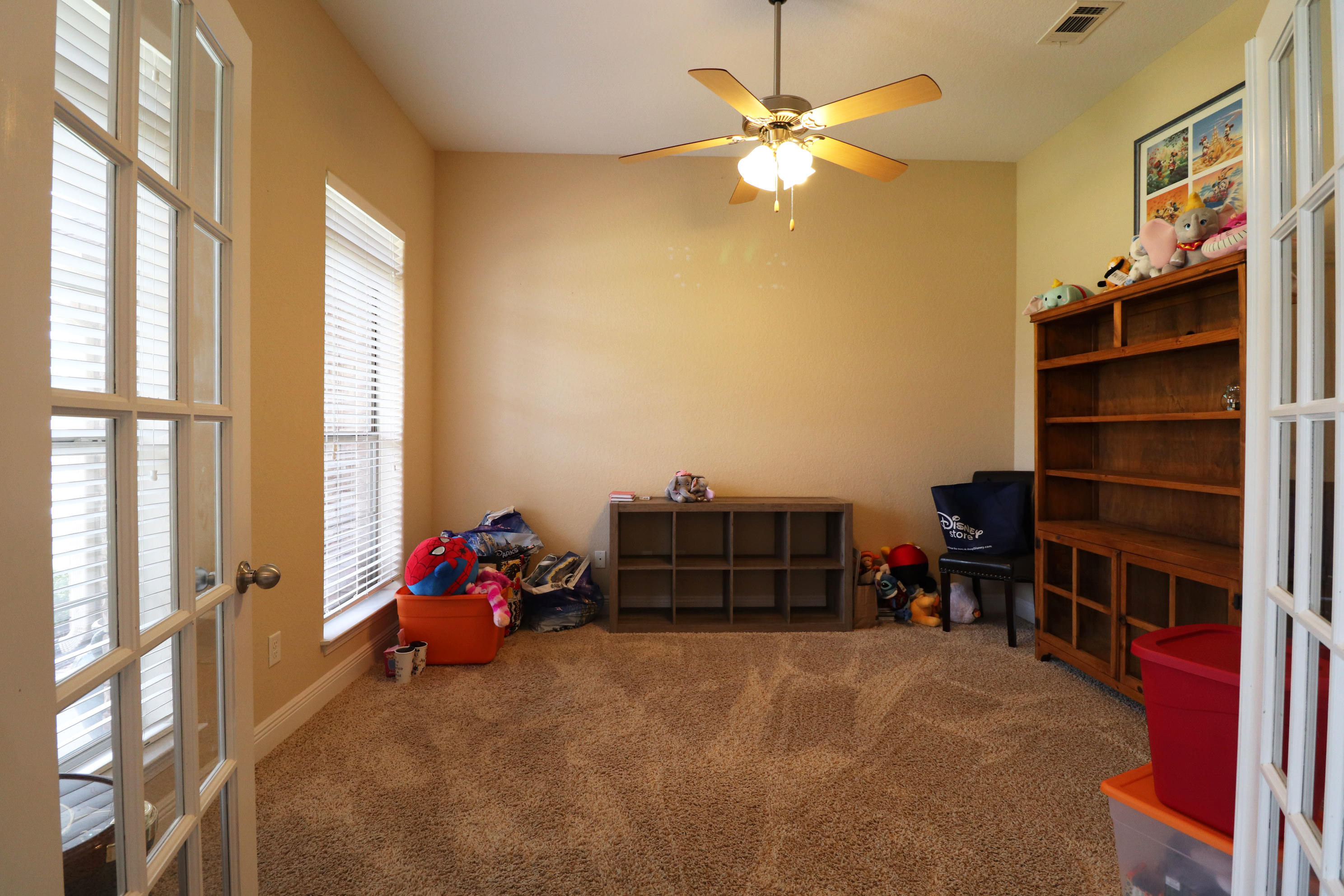 6181 Hummingbird Lane Crestview, FL 32536 - Photo 5 of 56 a living room with furniture and a book shelf
