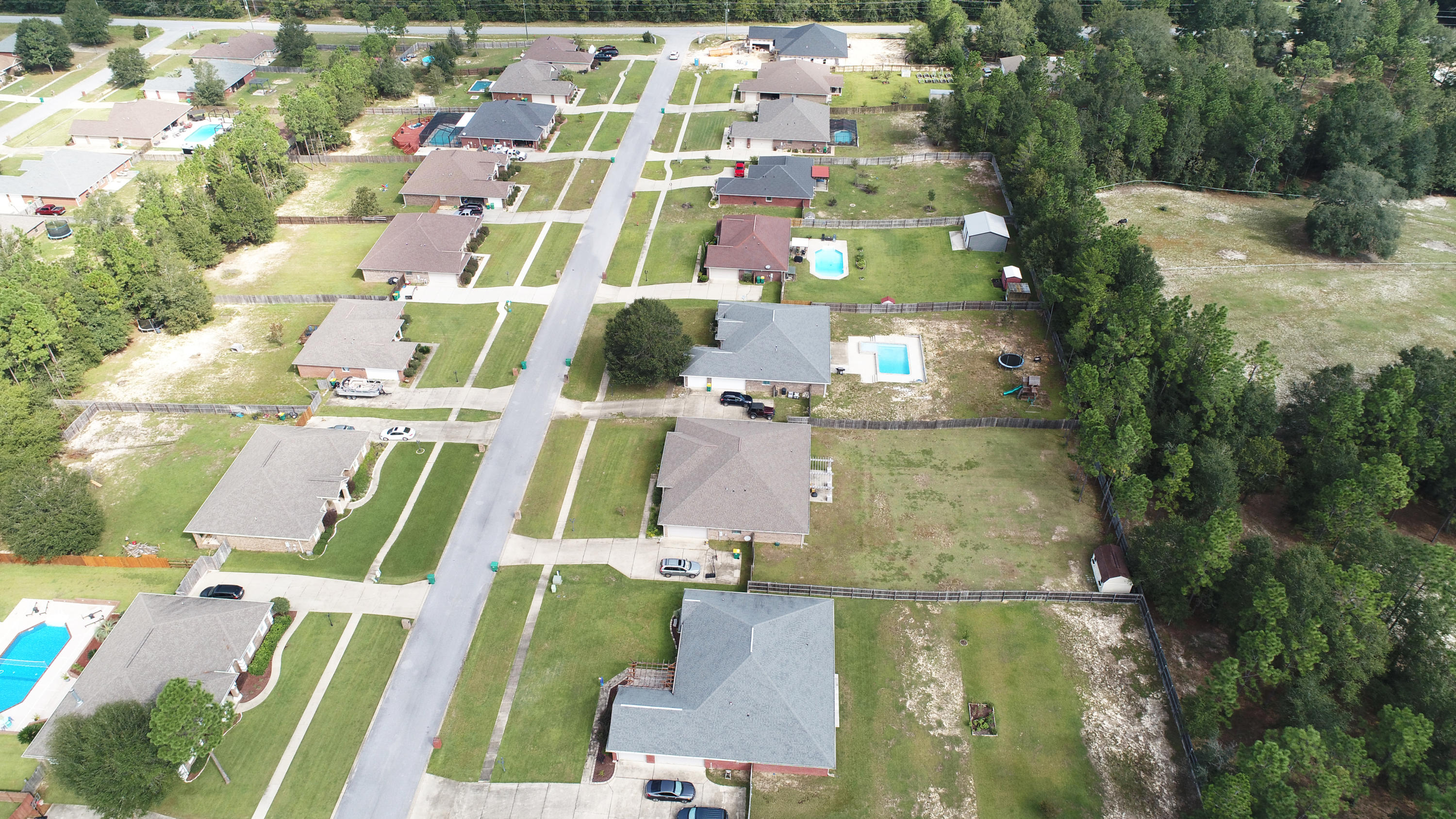 6181 Hummingbird Lane Crestview, FL 32536 - Photo 52 of 56 an aerial view of residential houses with outdoor space and street view