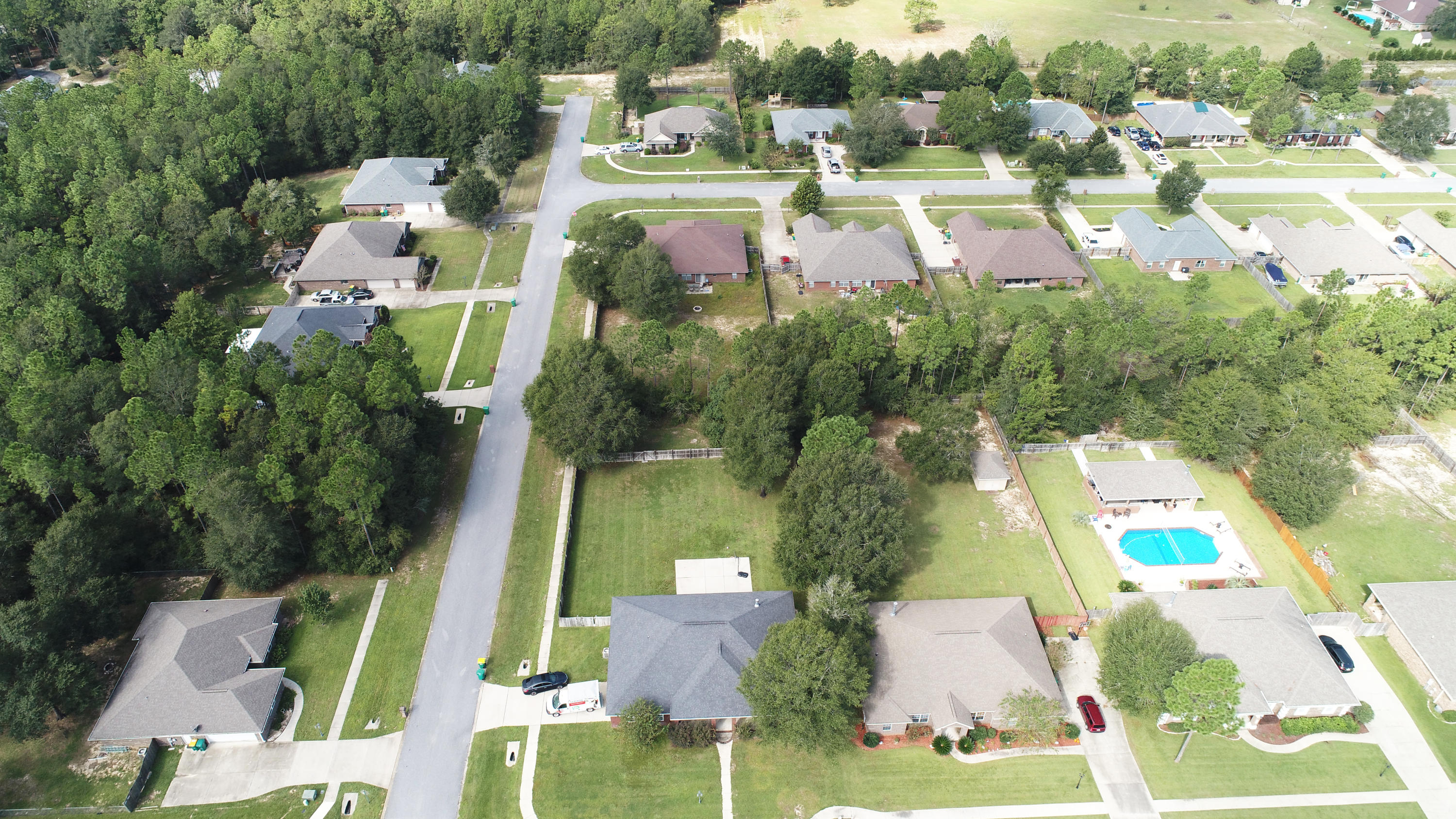 6181 Hummingbird Lane Crestview, FL 32536 - Photo 53 of 56 an aerial view of residential houses with outdoor space and street view