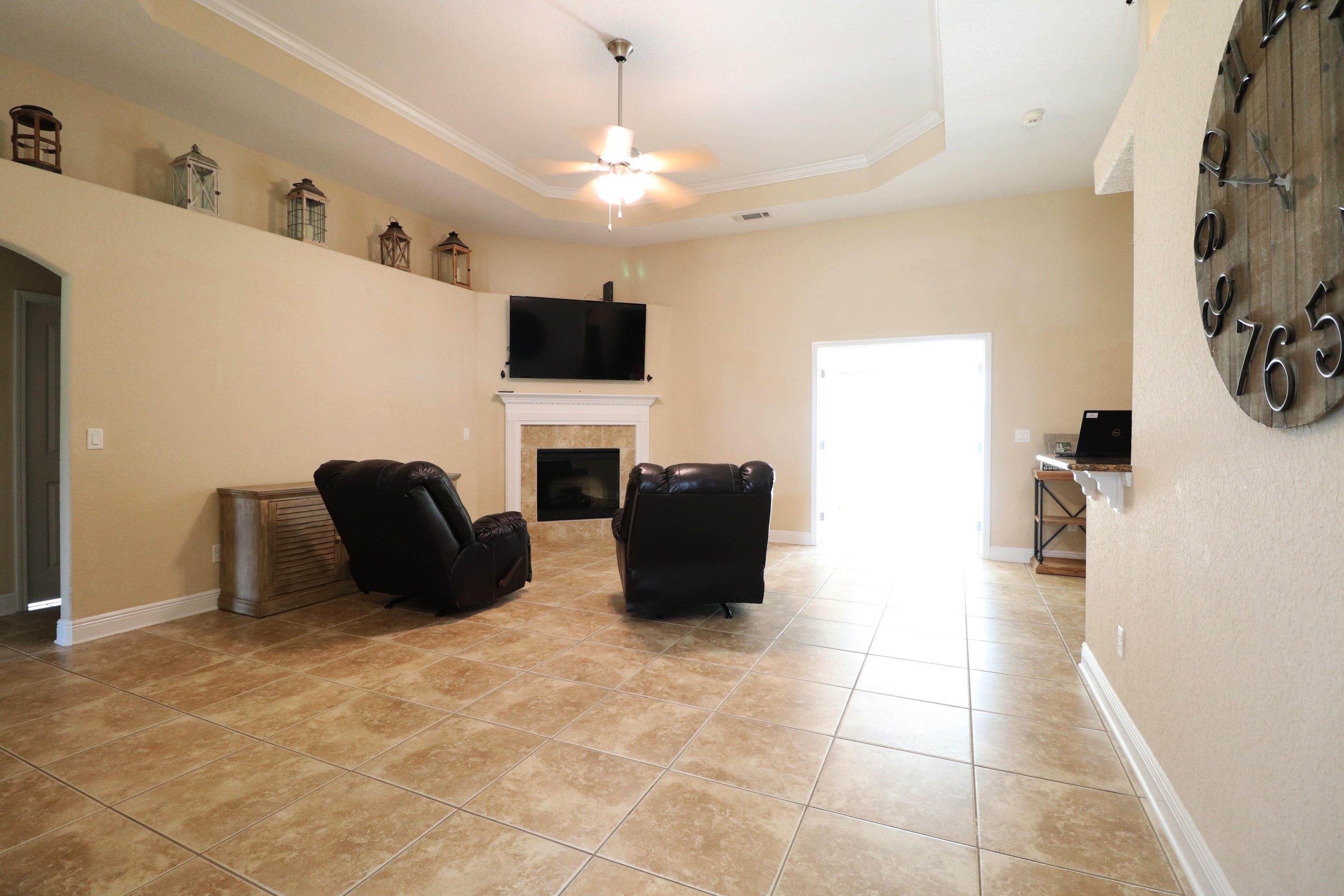 6181 Hummingbird Lane Crestview, FL 32536 - Photo 6 of 56 a living room with furniture and a flat screen tv