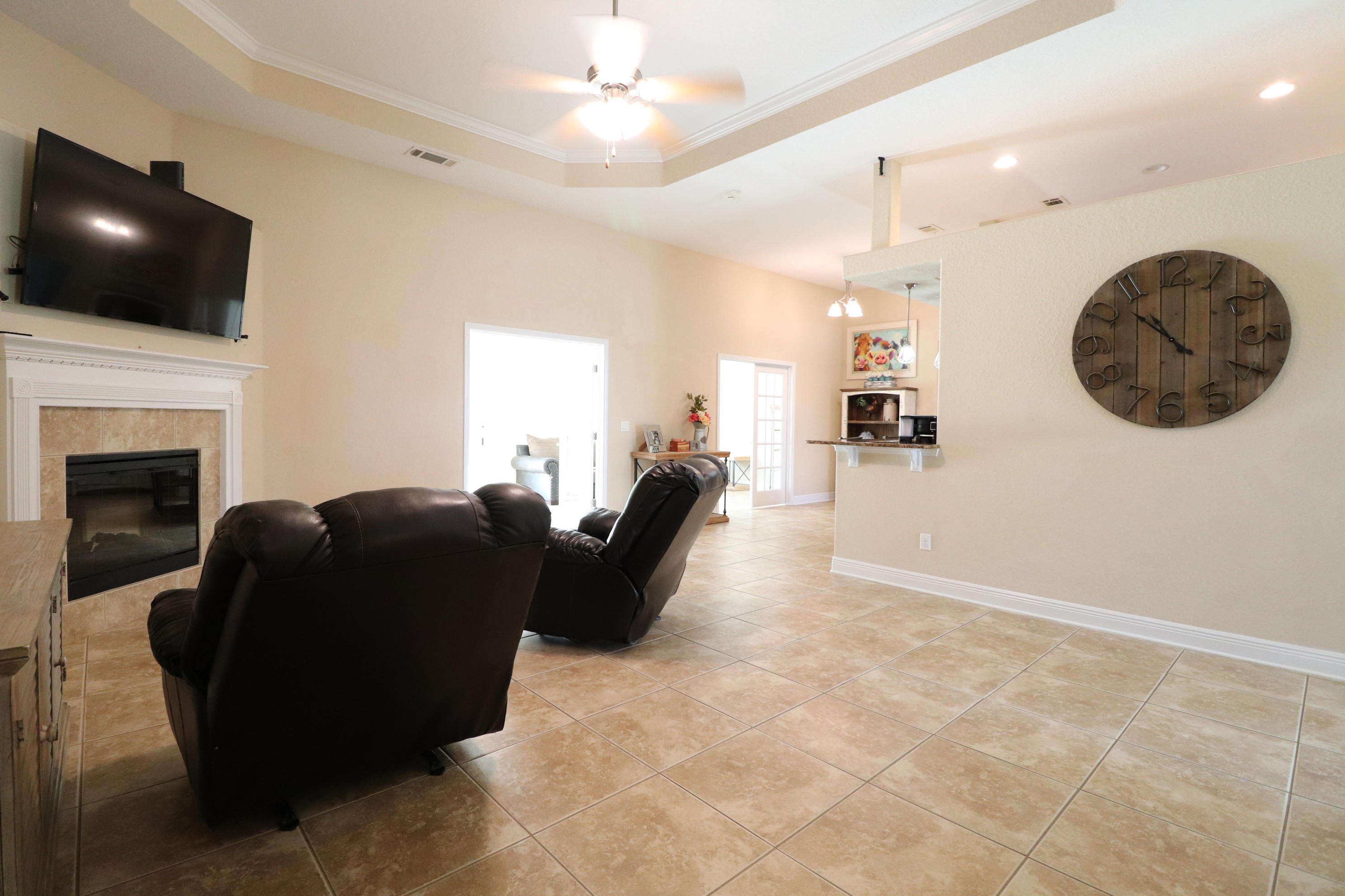 6181 Hummingbird Lane Crestview, FL 32536 - Photo 7 of 56 a living room with furniture and a flat screen tv