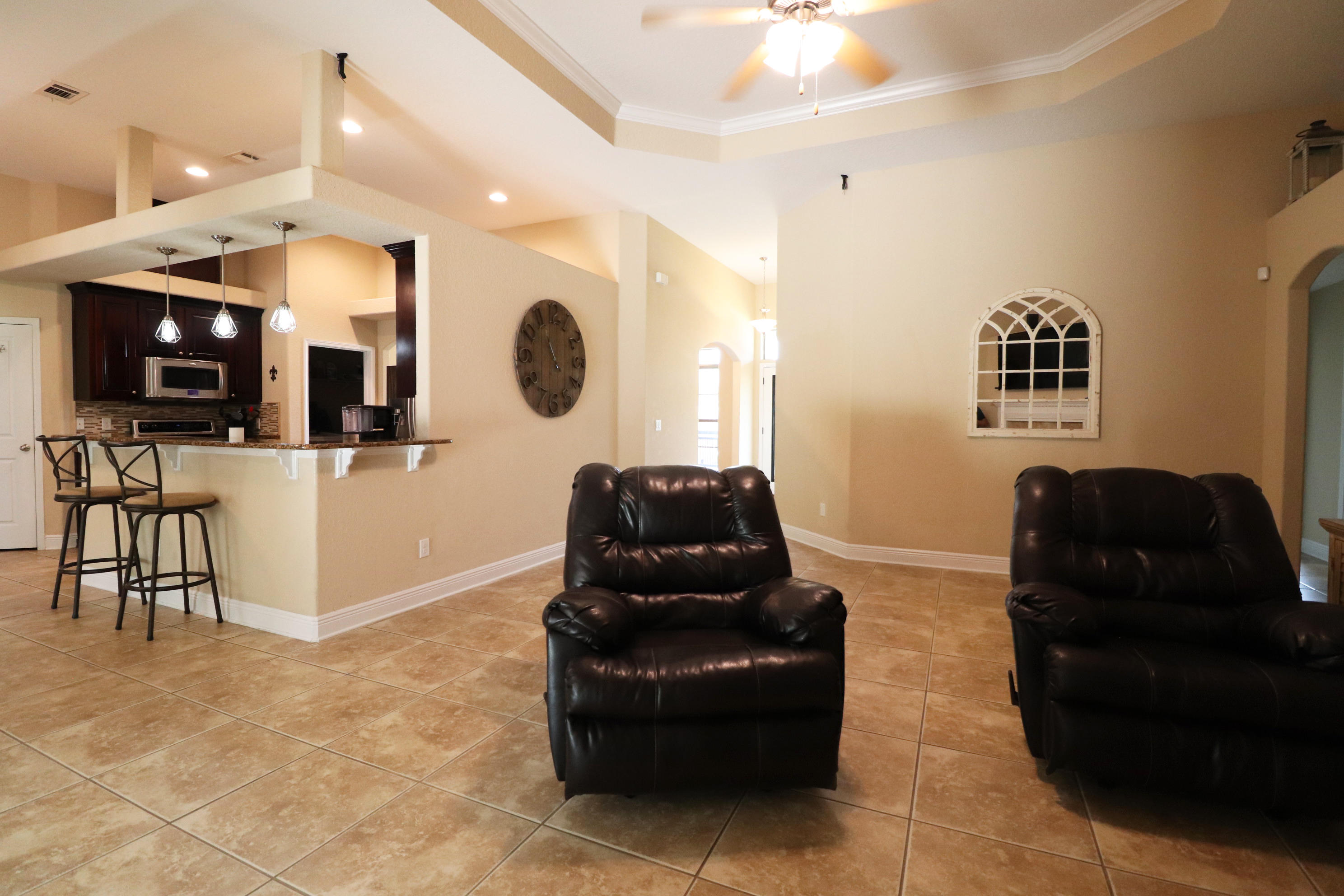 6181 Hummingbird Lane Crestview, FL 32536 - Photo 9 of 56 a living room with furniture and a flat screen tv
