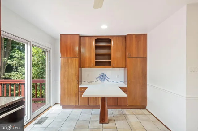 a kitchen with stainless steel appliances granite countertop a sink and cabinets