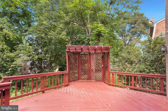 a view of a wooden deck and a yard